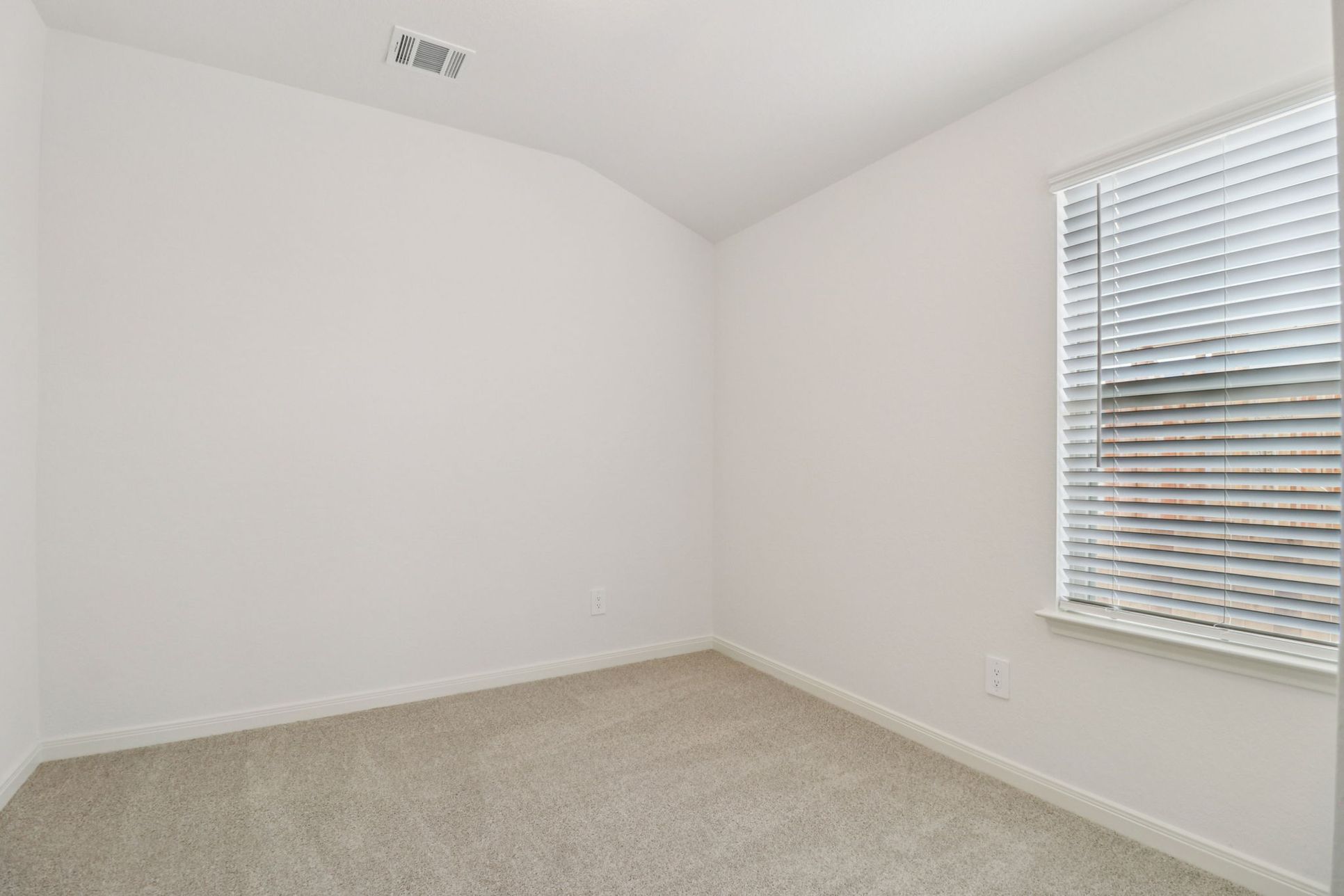 Guest bedroom in the Callaghan floorplan at a Meritage Homes community.:Guest Bedroom
