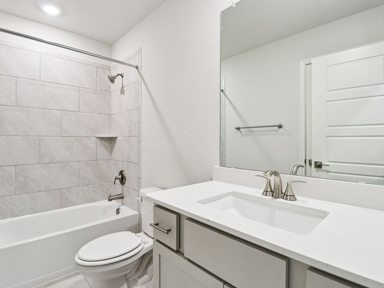 Guest bathroom in the Henderson floorplan at a Meritage Homes community.:Guest Bathroom