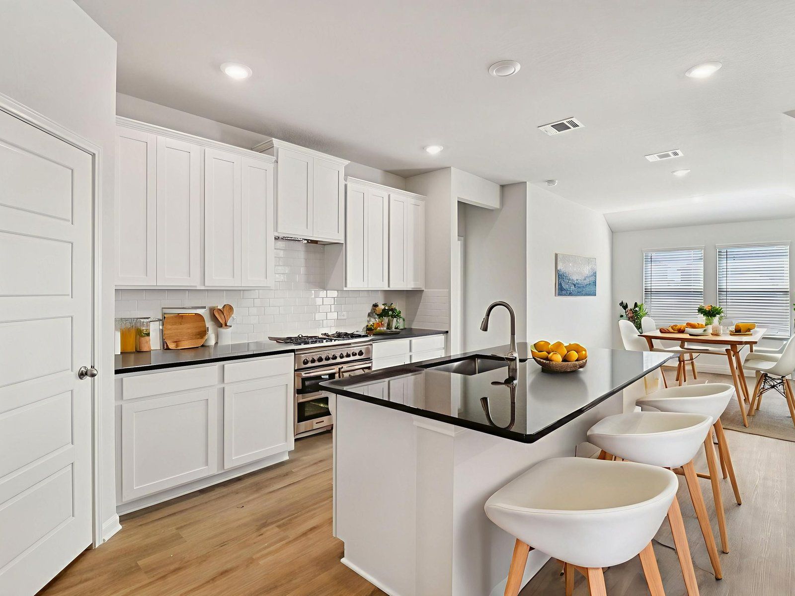 Virtually staged kitchen in the Callaghan floorplan at a Meritage Homes community.:Virtually Staged Kitchen