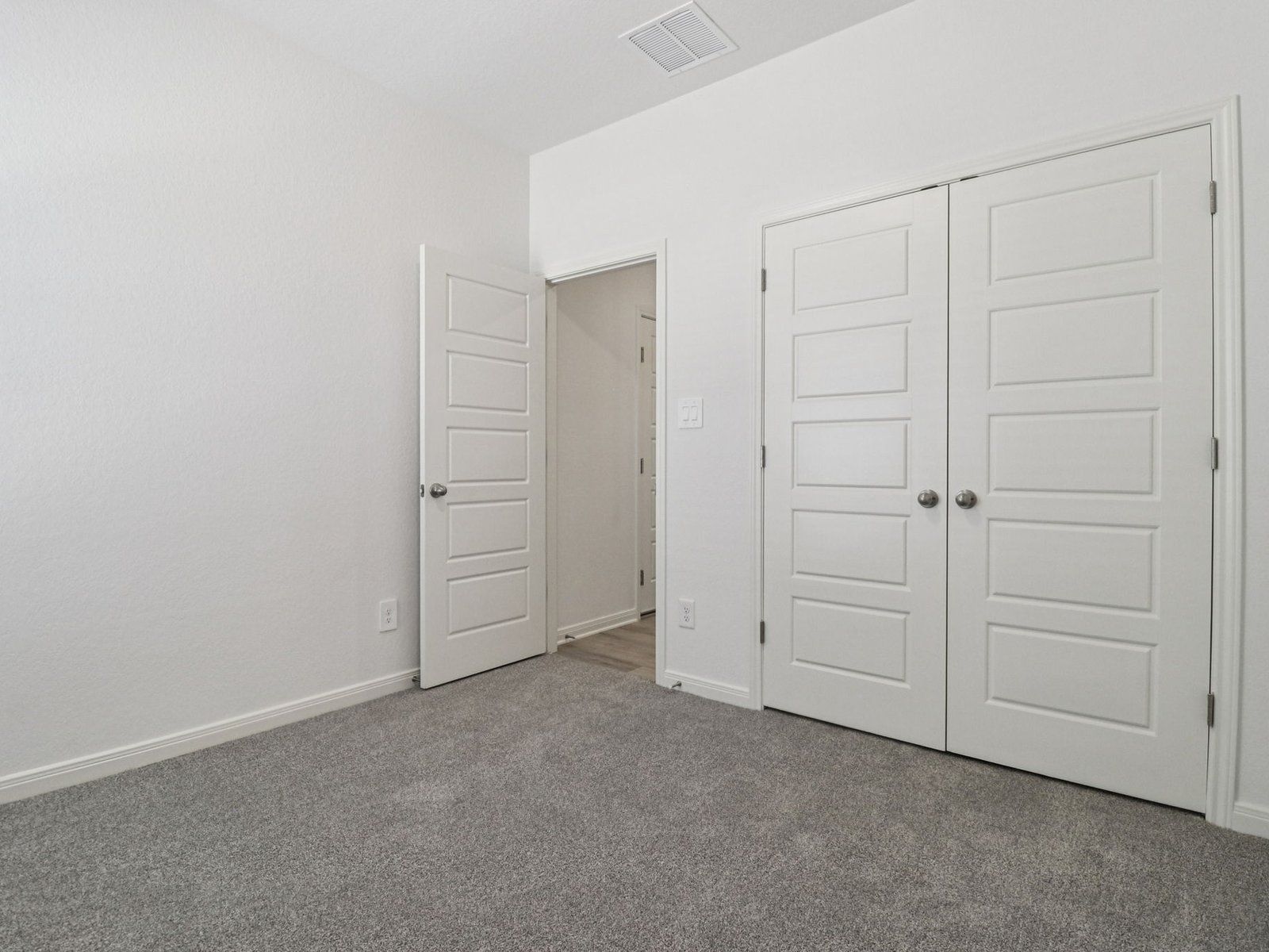 Guest Bedroom:Guest bedroom in the Callaghan floorplan at a Meritage Homes community.