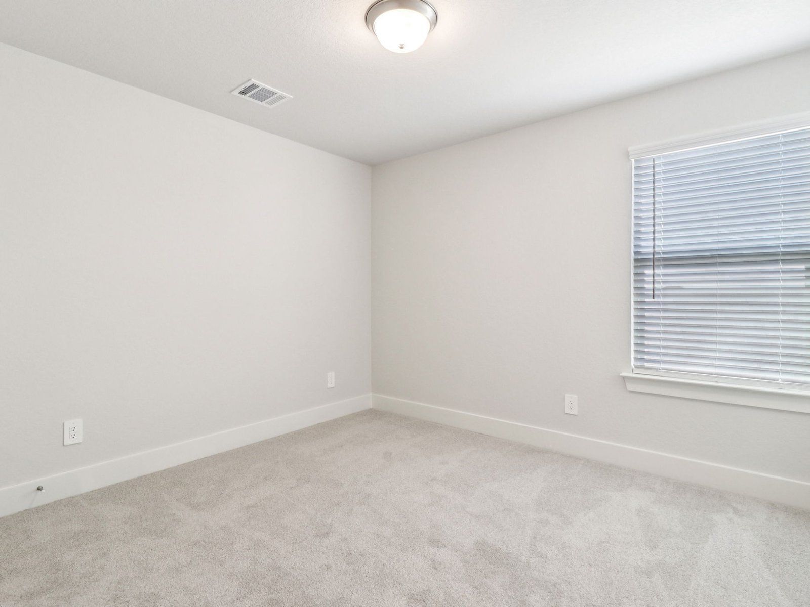 Guest bedroom in the Reynolds floorplan at a Meritage Homes community.:Guest Bedroom