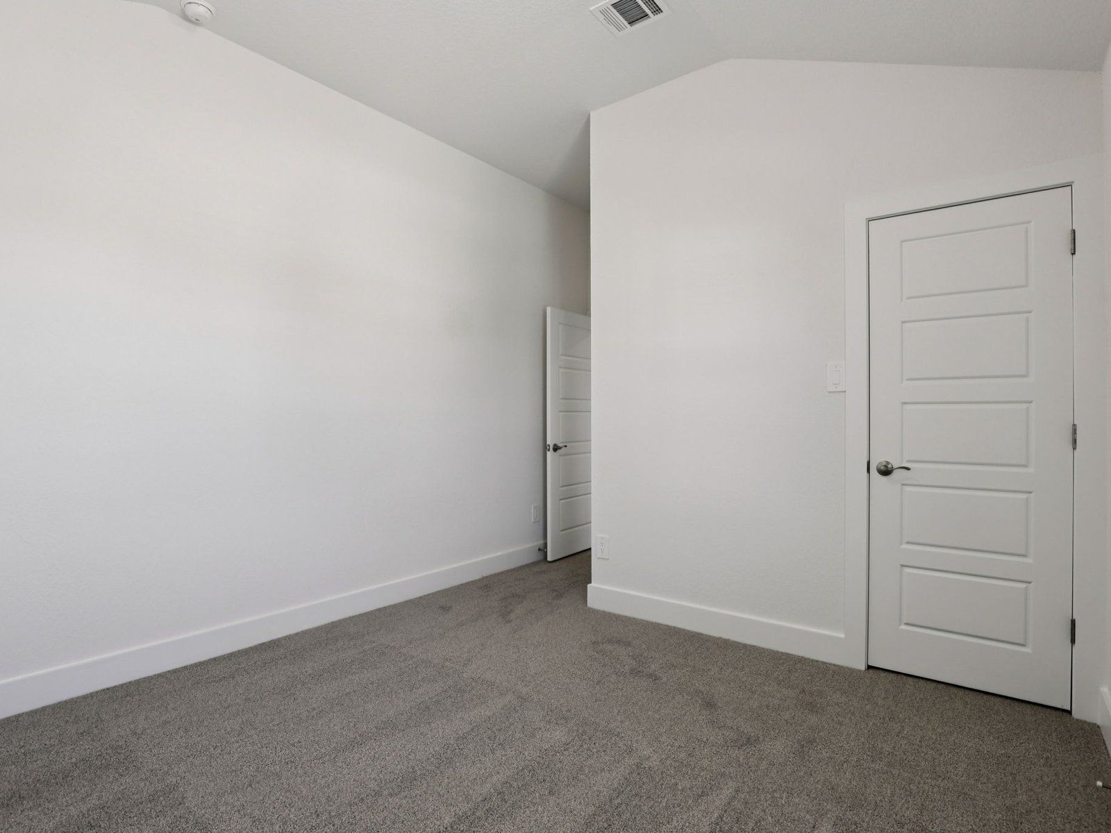 Guest bedroom in the Pine floorplan at a Meritage Homes community.:Guest Bedroom