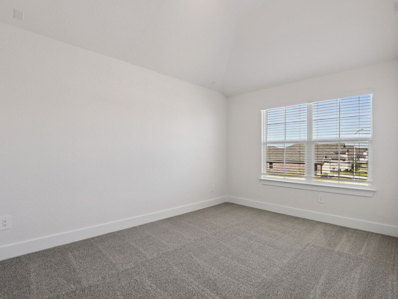 Guest Bedroom:Guest bedroom in the Pine floorplan at a Meritage Homes community.