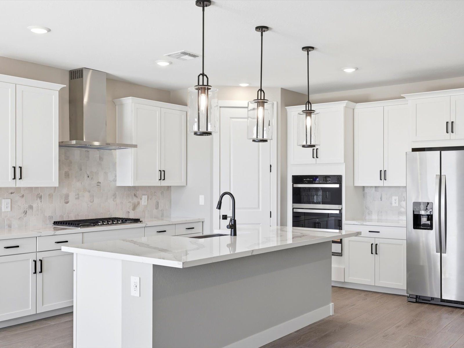 Kitchen:The Sawyer floorplan interior image taken at a Meritage Homes community in Waddell, AZ.