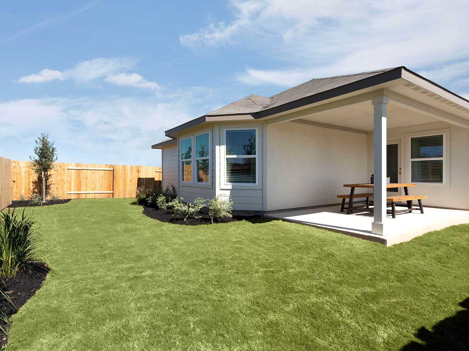 Stay connected to nature with a tranquil outdoor living area.:Stay connected to nature with a tranquil outdoor living area.