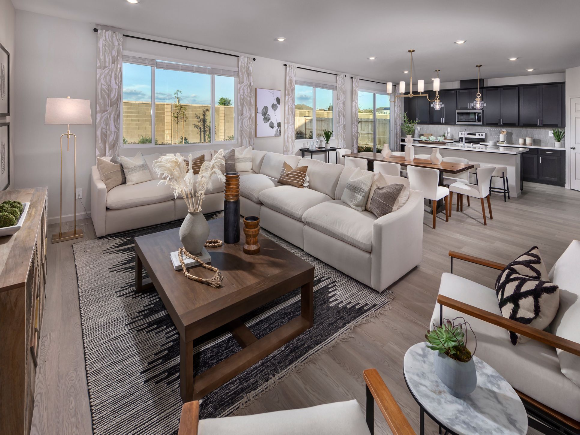 NCA_ArroyoGrove_Plan4_Overall_1660EagleRiverAve_Model:Great room at a Meritage Homes community in Manteca, CA.