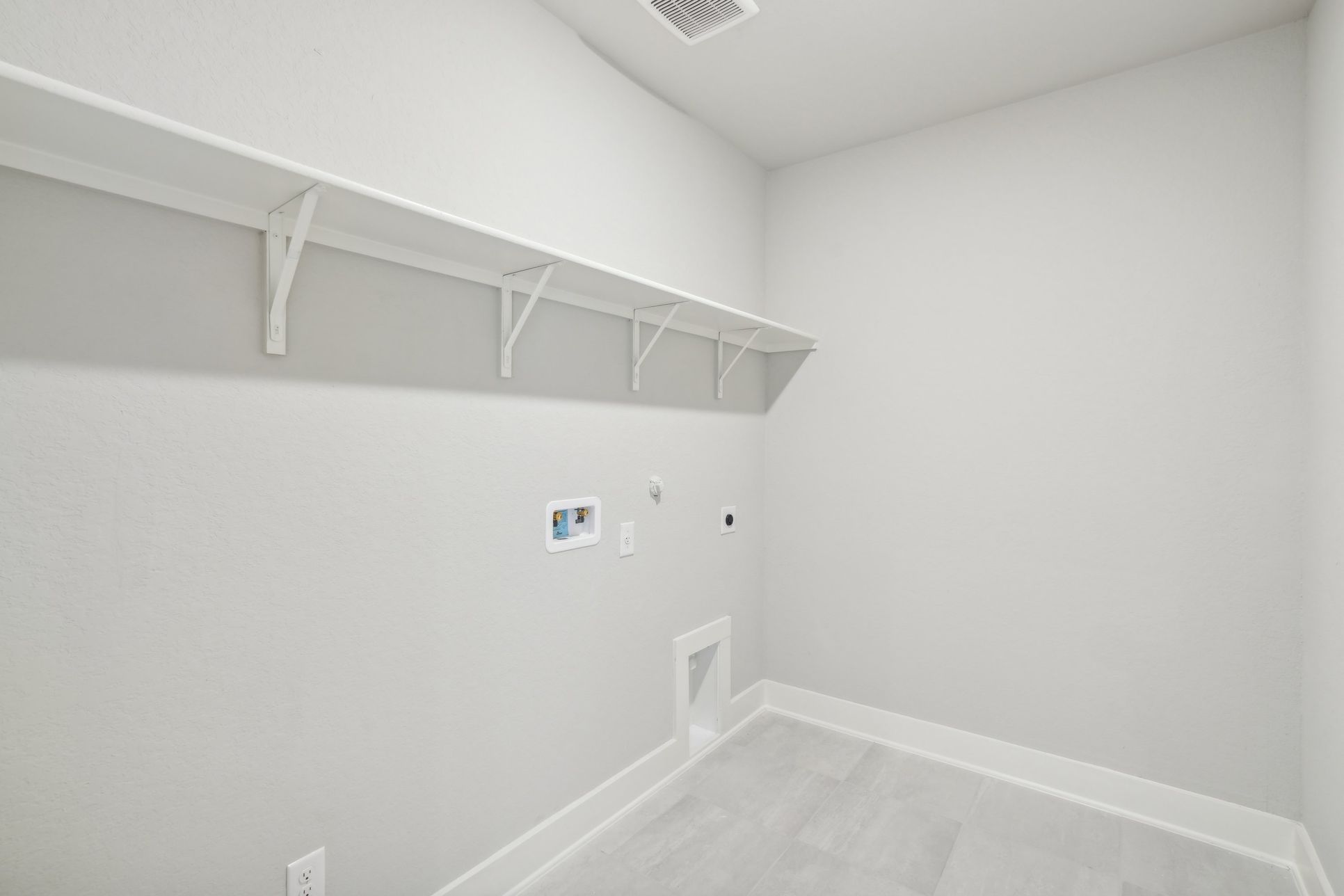 Laundry room in the Hughes floorplan at a Meritage Homes community.:Laundry Room
