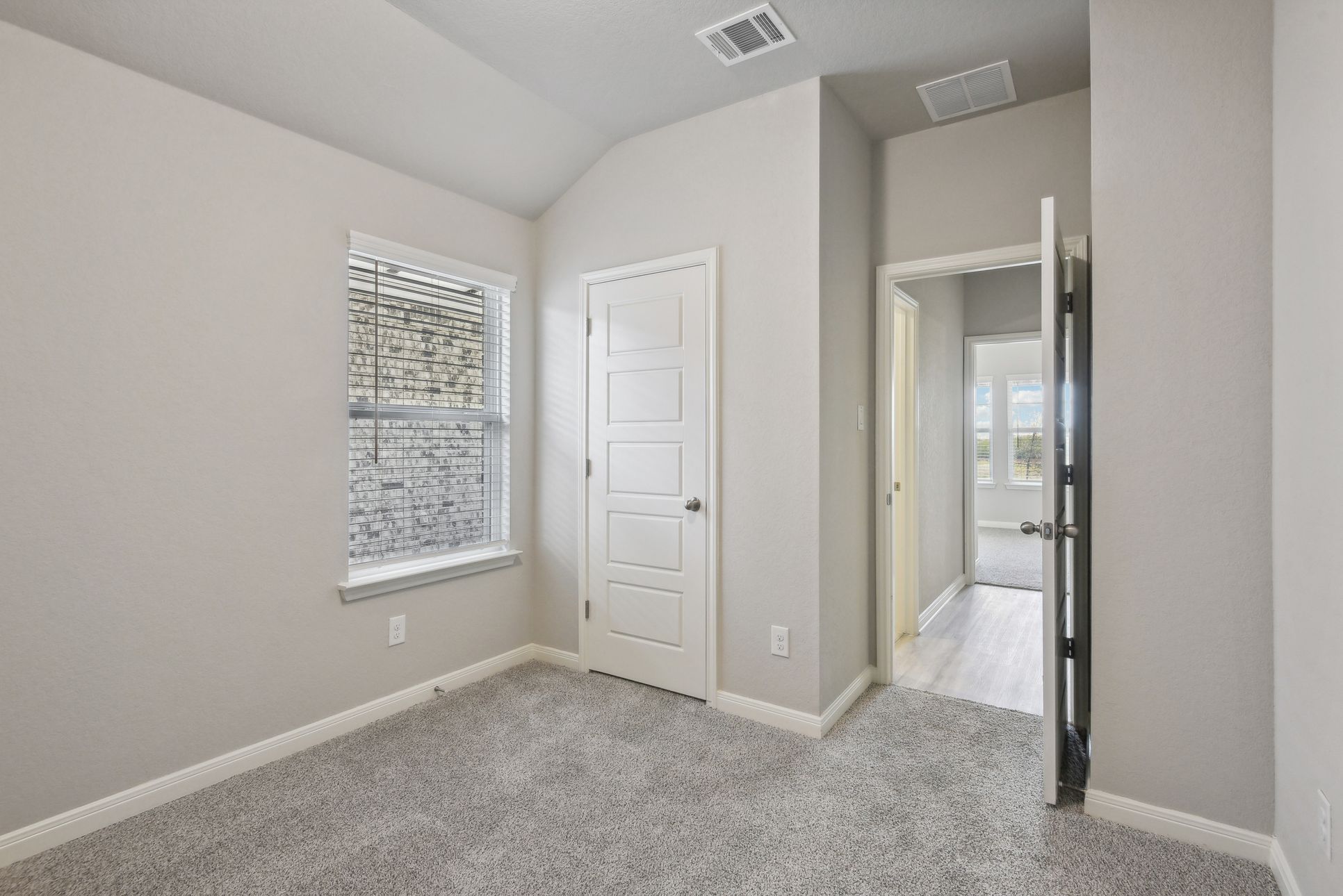 Guest Bedroom:Guest bedroom in the Callaghan floorplan at a Meritage Homes community.
