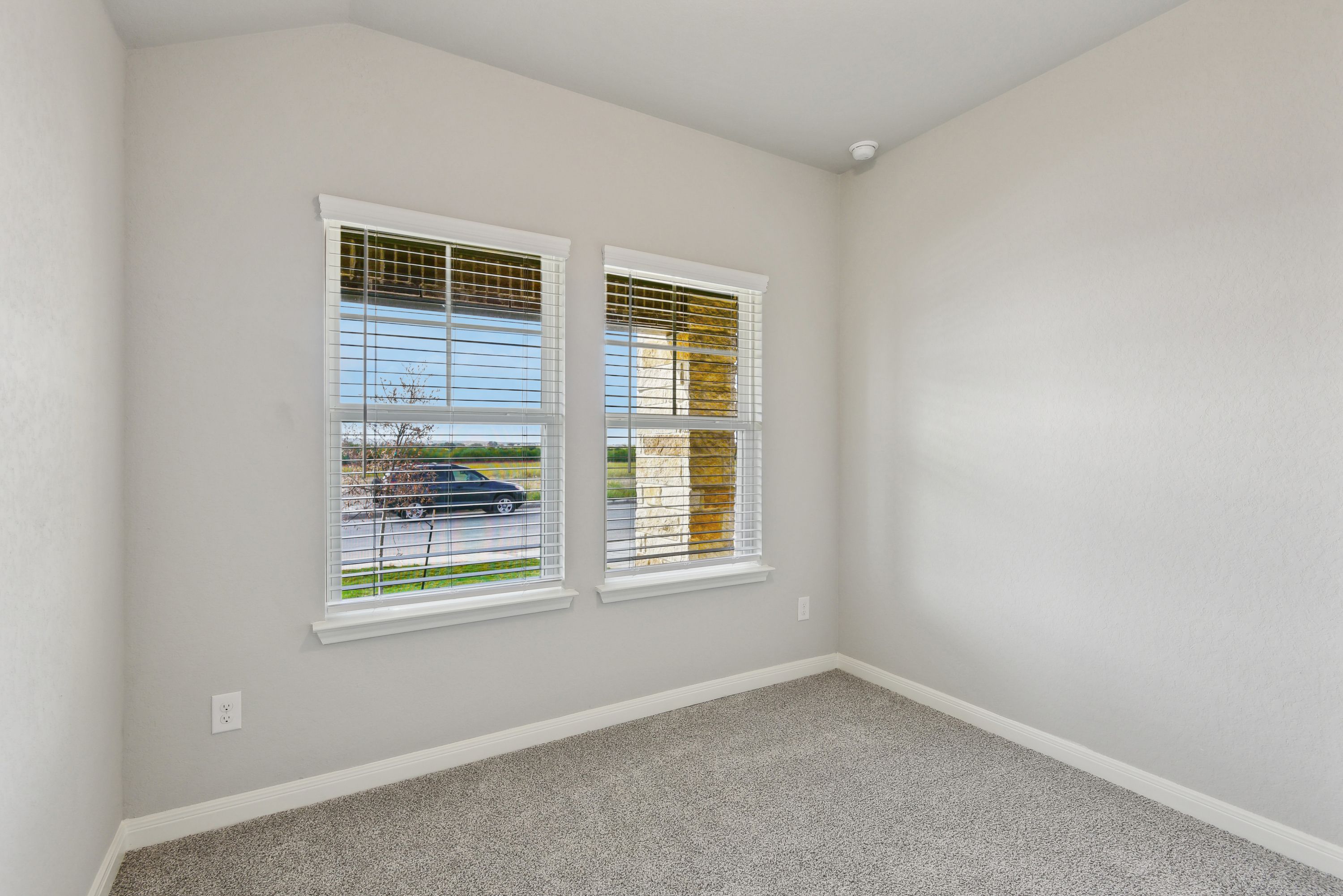 Guest Bedroom:Guest bedroom in the Callaghan floorplan at a Meritage Homes community.