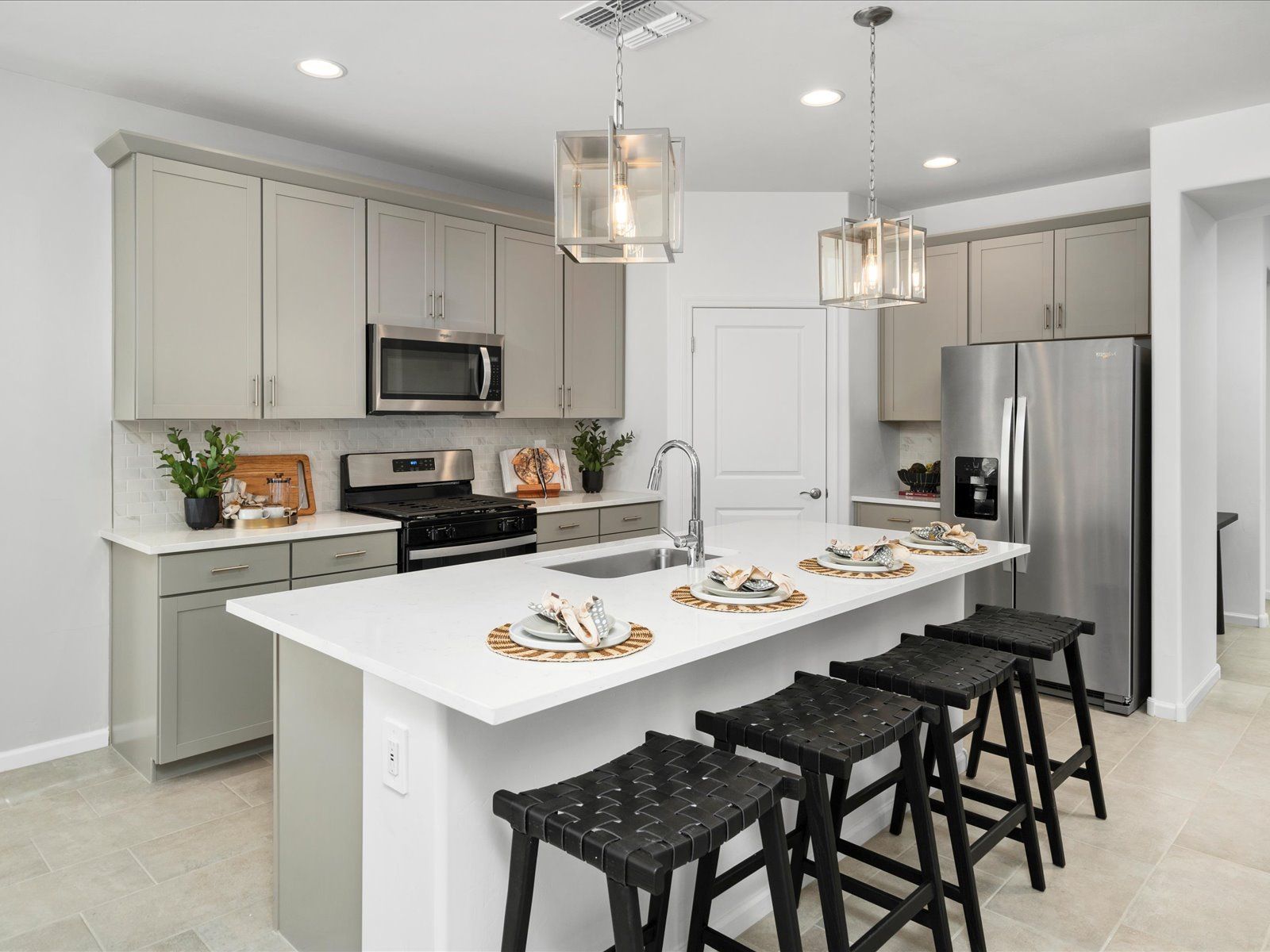 Enjoy an open concept kitchen complete with a suite of Whirlpool® appliances.