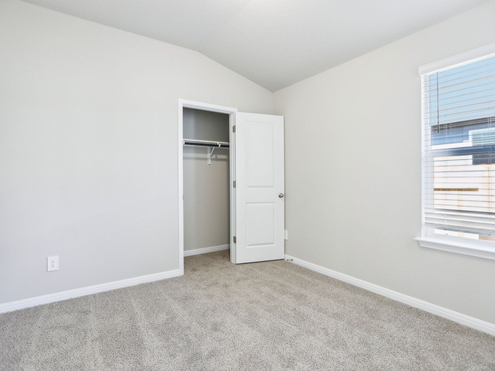 The Gage floorplan includes two secondary bedrooms and one secondary bathroom.:Secondary Bedroom 1 in Waterstone Crossing at Meritage Homes in Austin, TX.