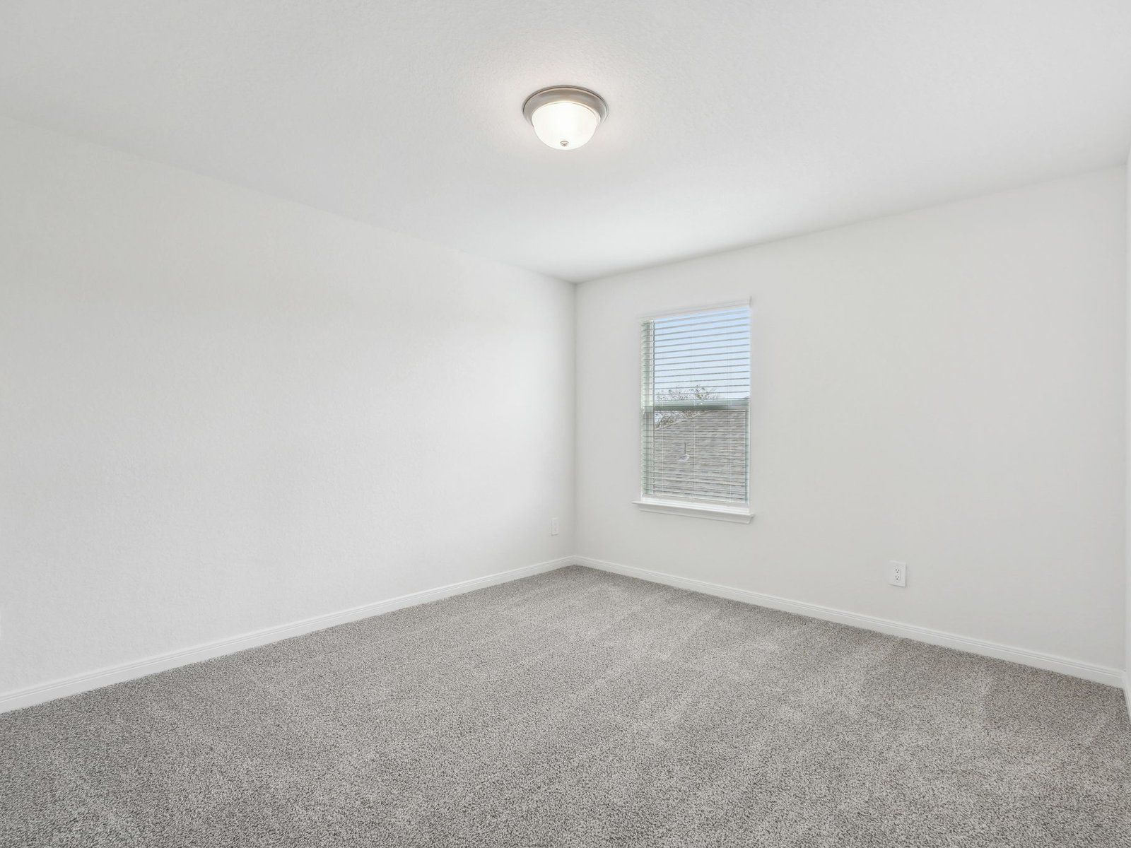 Guest Bedroom:Guest bedroom in the Sabine floorplan at a Meritage Homes community.