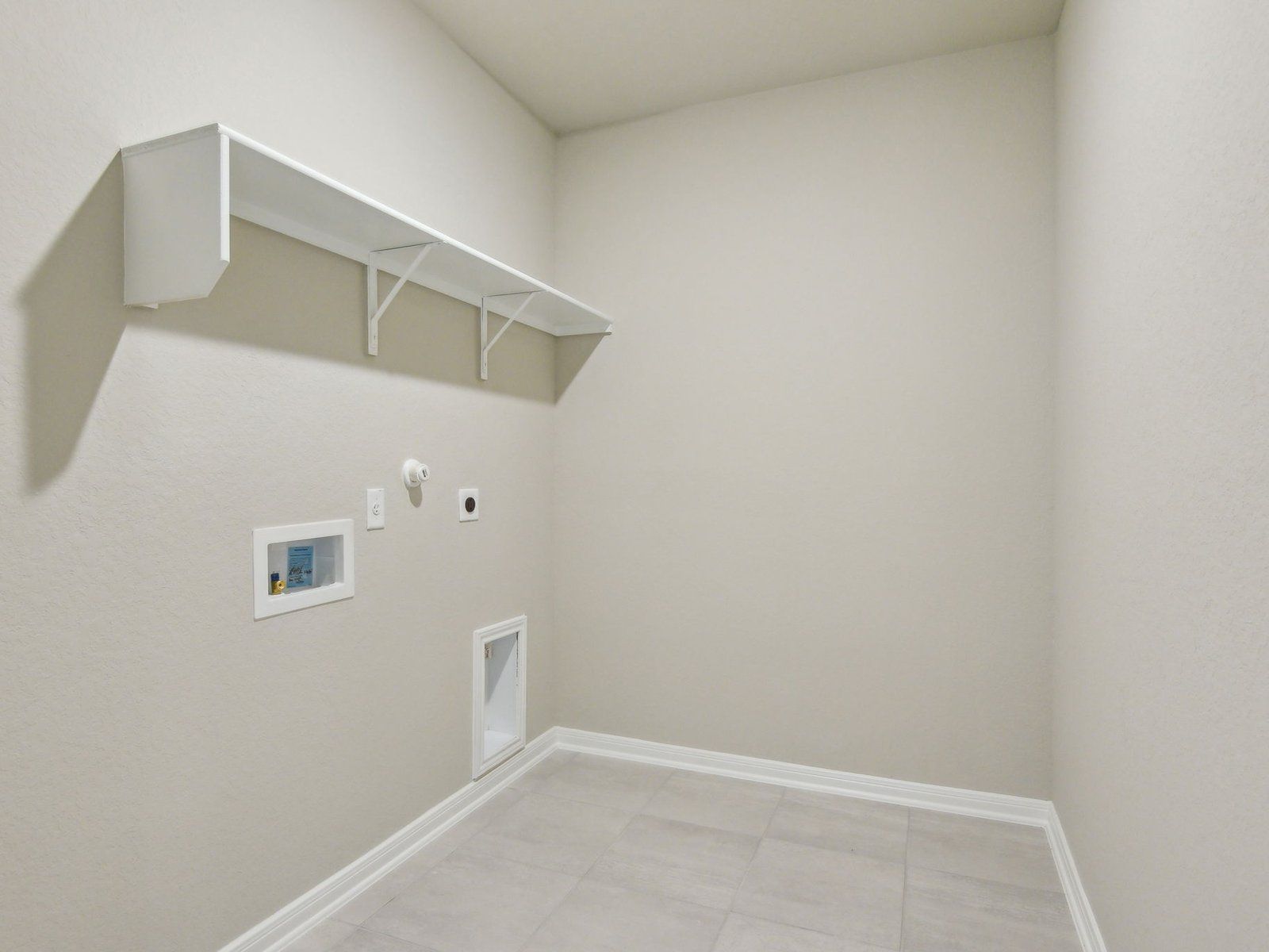 Laundry room in the Allen floorplan at a Meritage Homes community.:Laundry Room