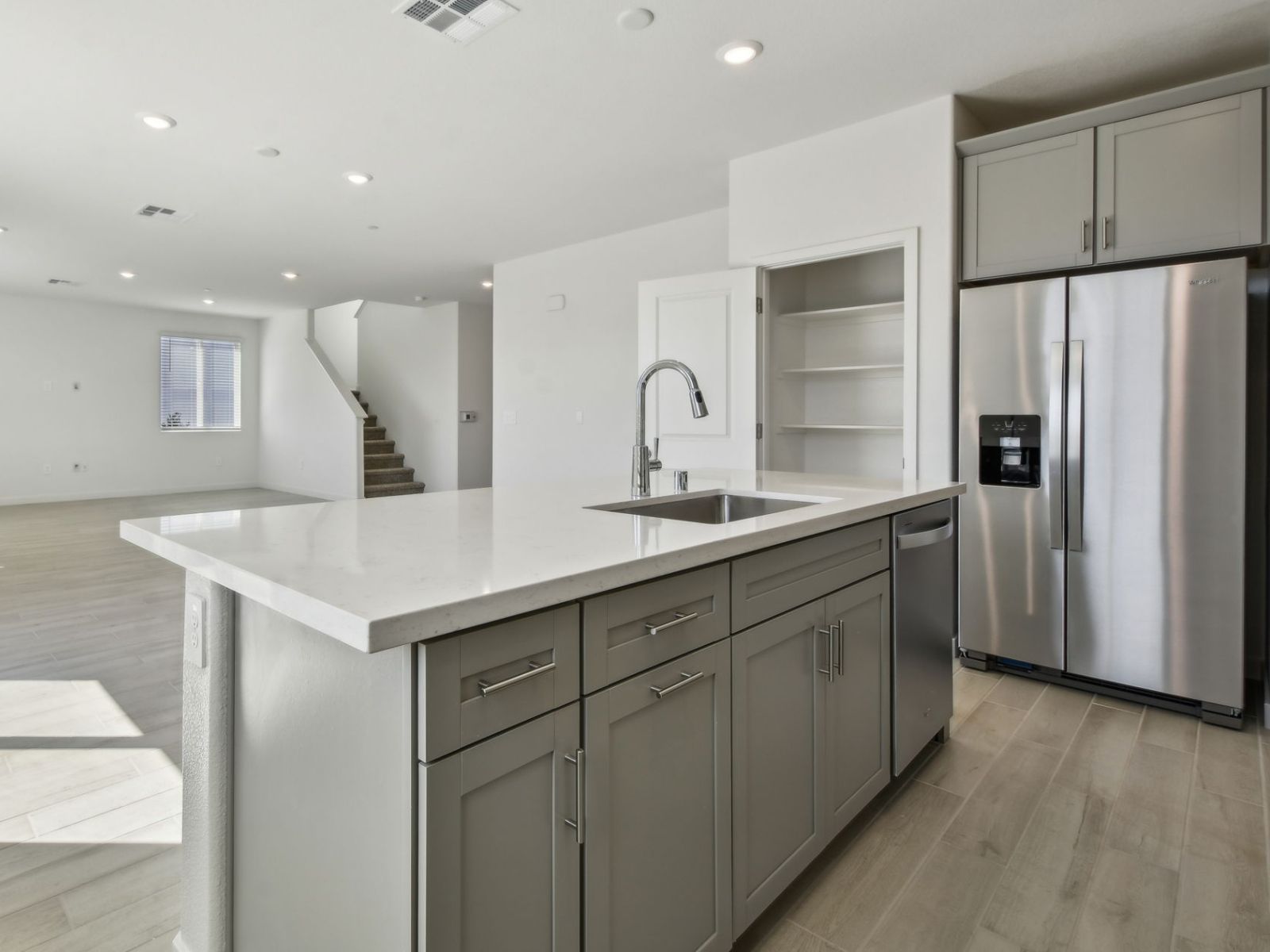 Open-concept kitchen, dining, and living room allows you to feel connected with others, whether you're cooking a meal or watching TV.