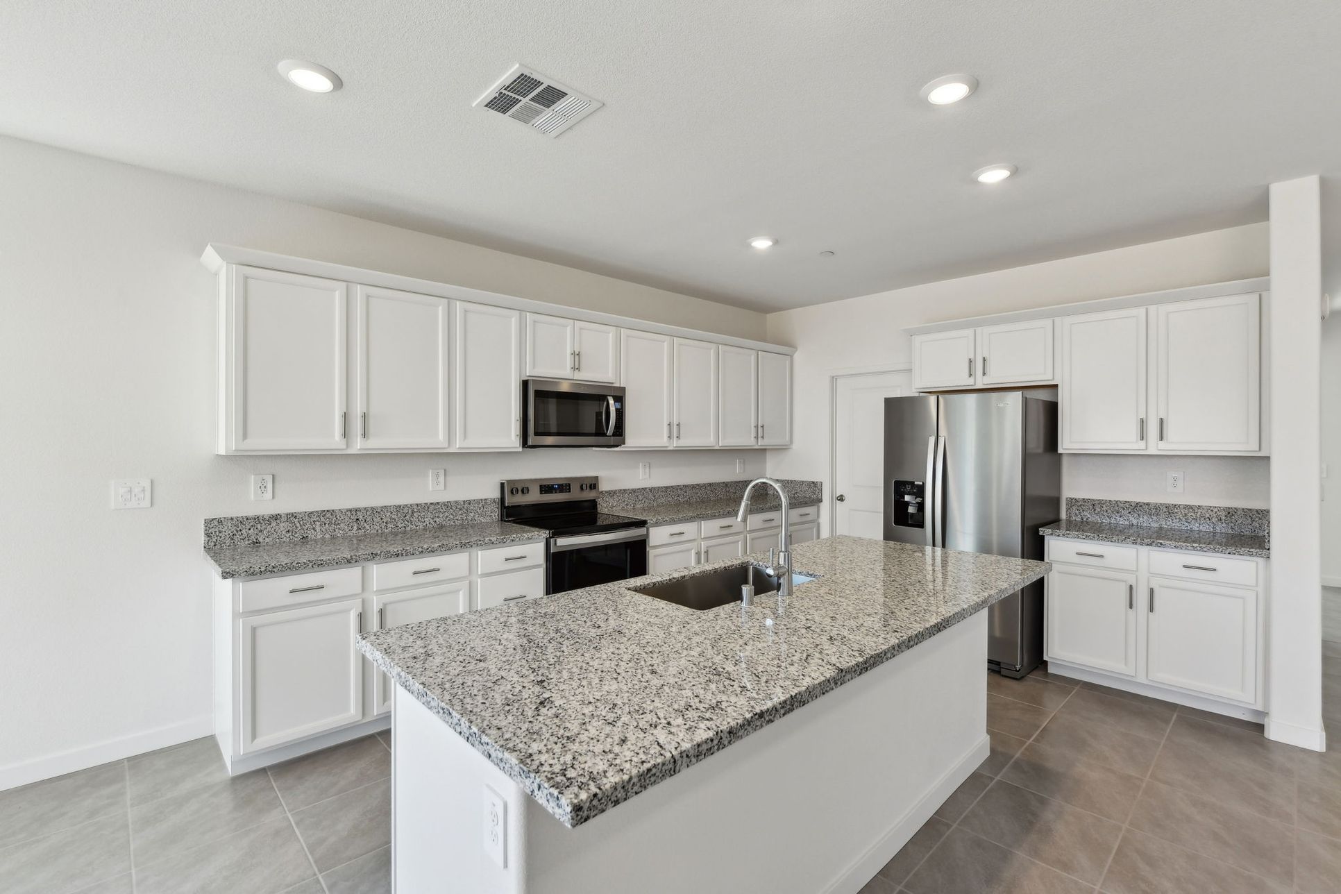 NCA_Monument_4025_Kitchen_1291_RevereLoop_2.jpg:A Residence 3 built in a nearby Meritage Homes Community in Galt, CA.
