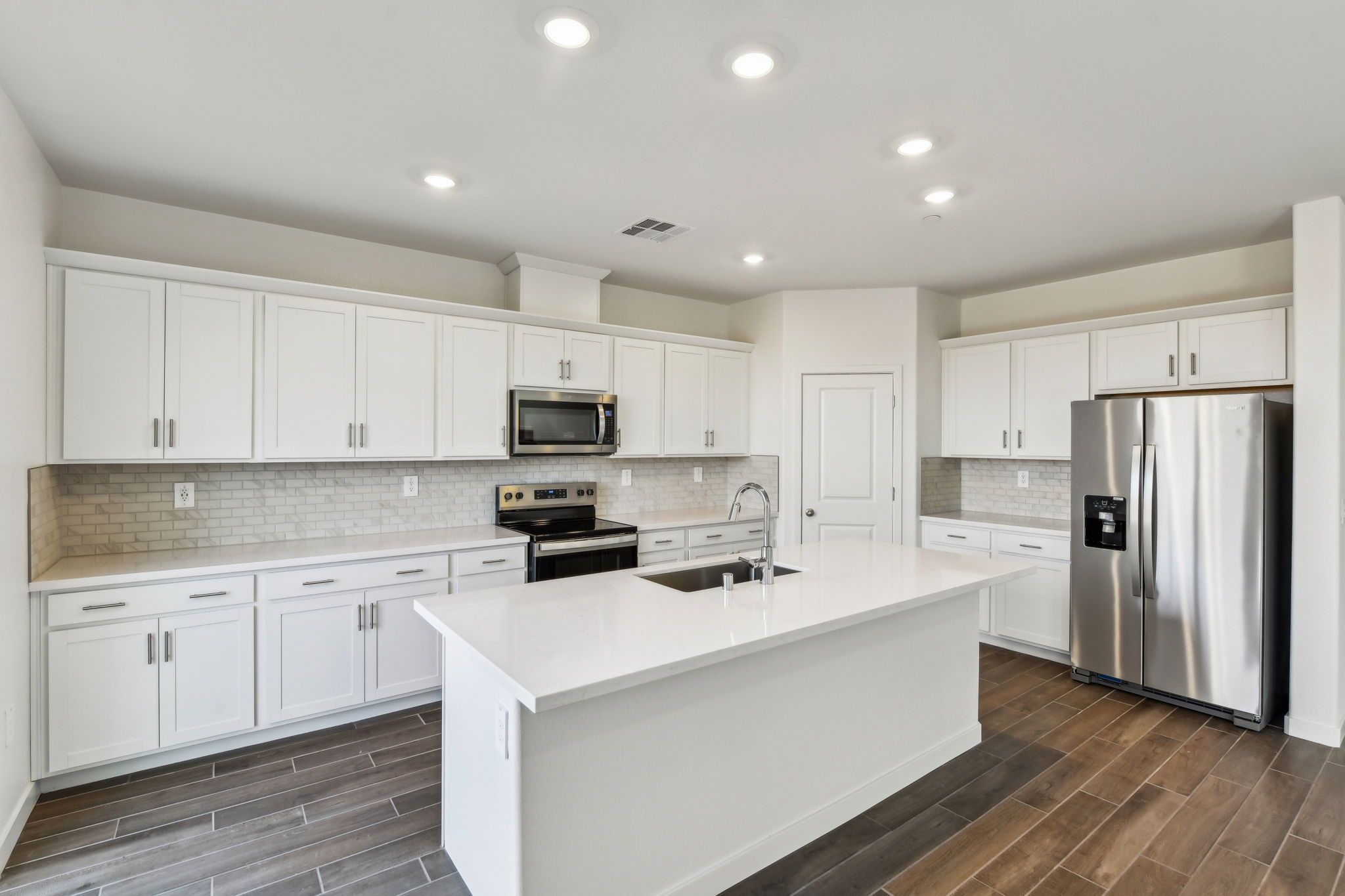 NCA_Rushmore_4523_ Kitchen_1437_McIntyreSt_.jpg:Residence 2 kitchen shown at a nearby Meritage Homes Community.