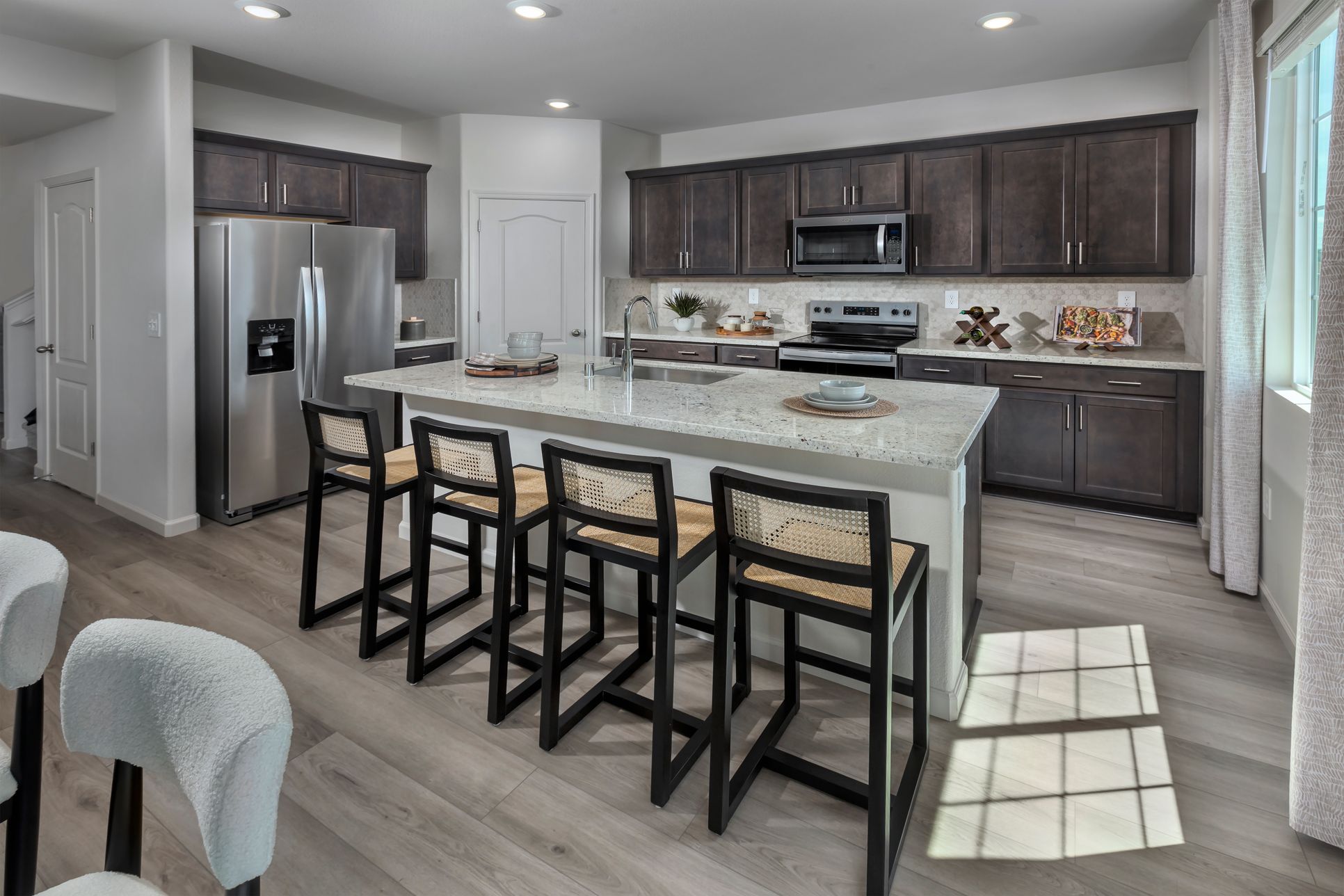 NCA_ASPEN_PLAN_3_KITCHEN_VIEW_1.jpg:Modeled Residence 3 of Aspen at Villa Ticino in Manteca, CA.