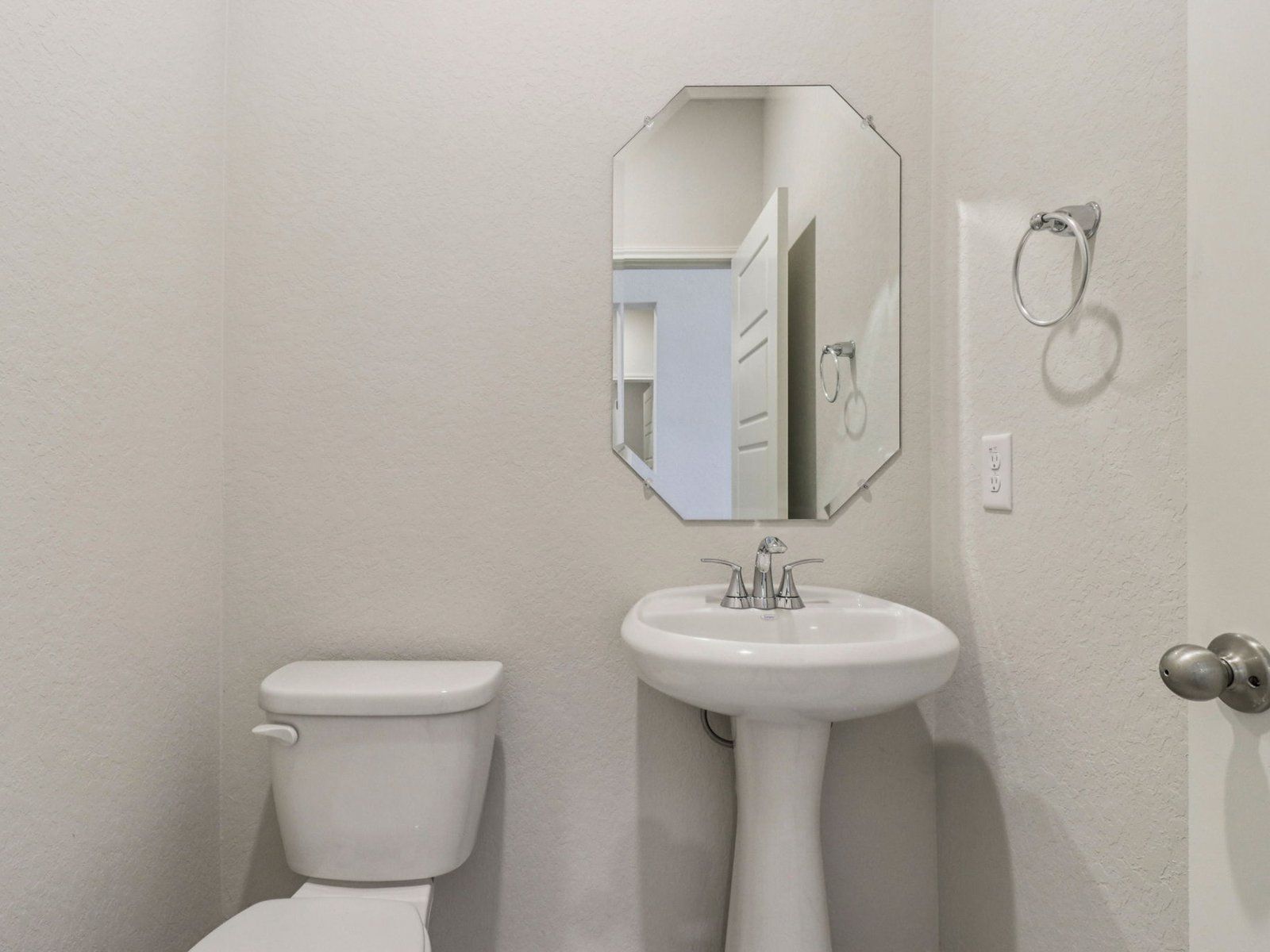 Powder room in the Evergreen floorplan at a Meritage Homes community in San Antonio, TX.:Powder Room