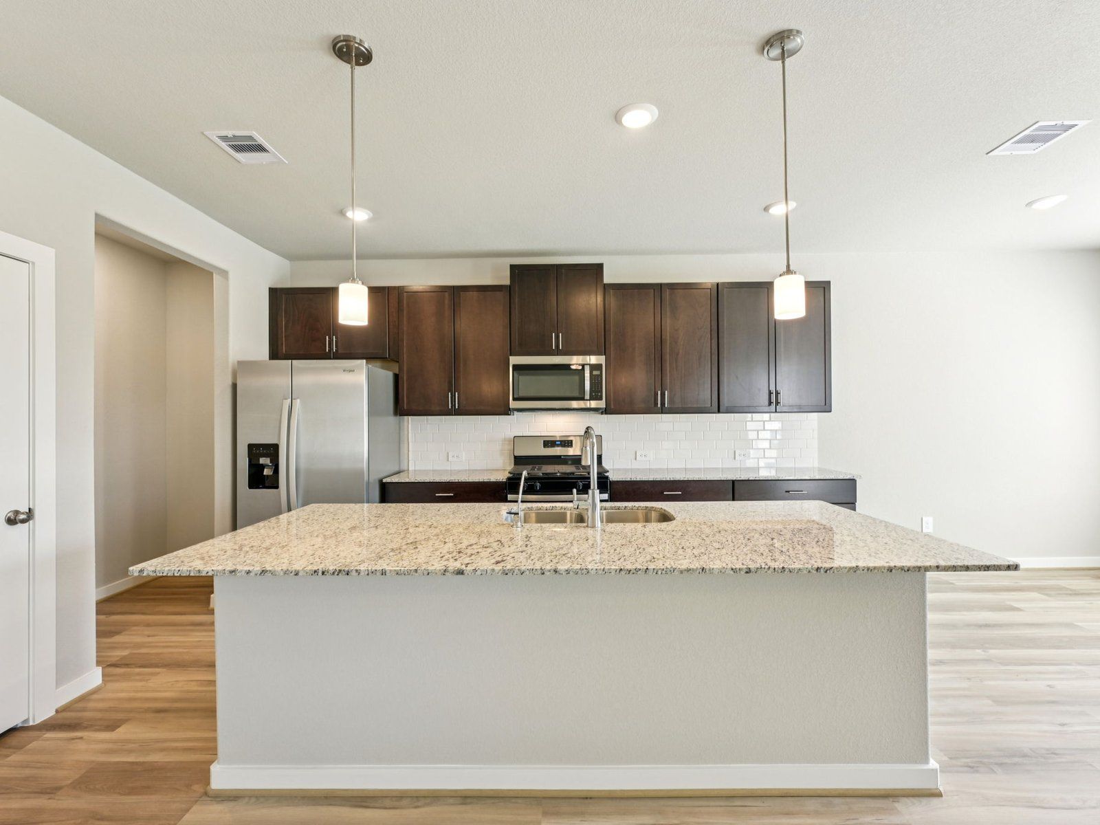 Kitchen:The Ian floorplan in Stewart's Ranch of Conroe, TX.