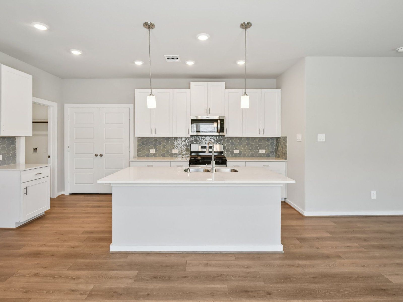 The Olympic floorplan in Pine Lake Cove of Montgomery, TX.:Kitchen