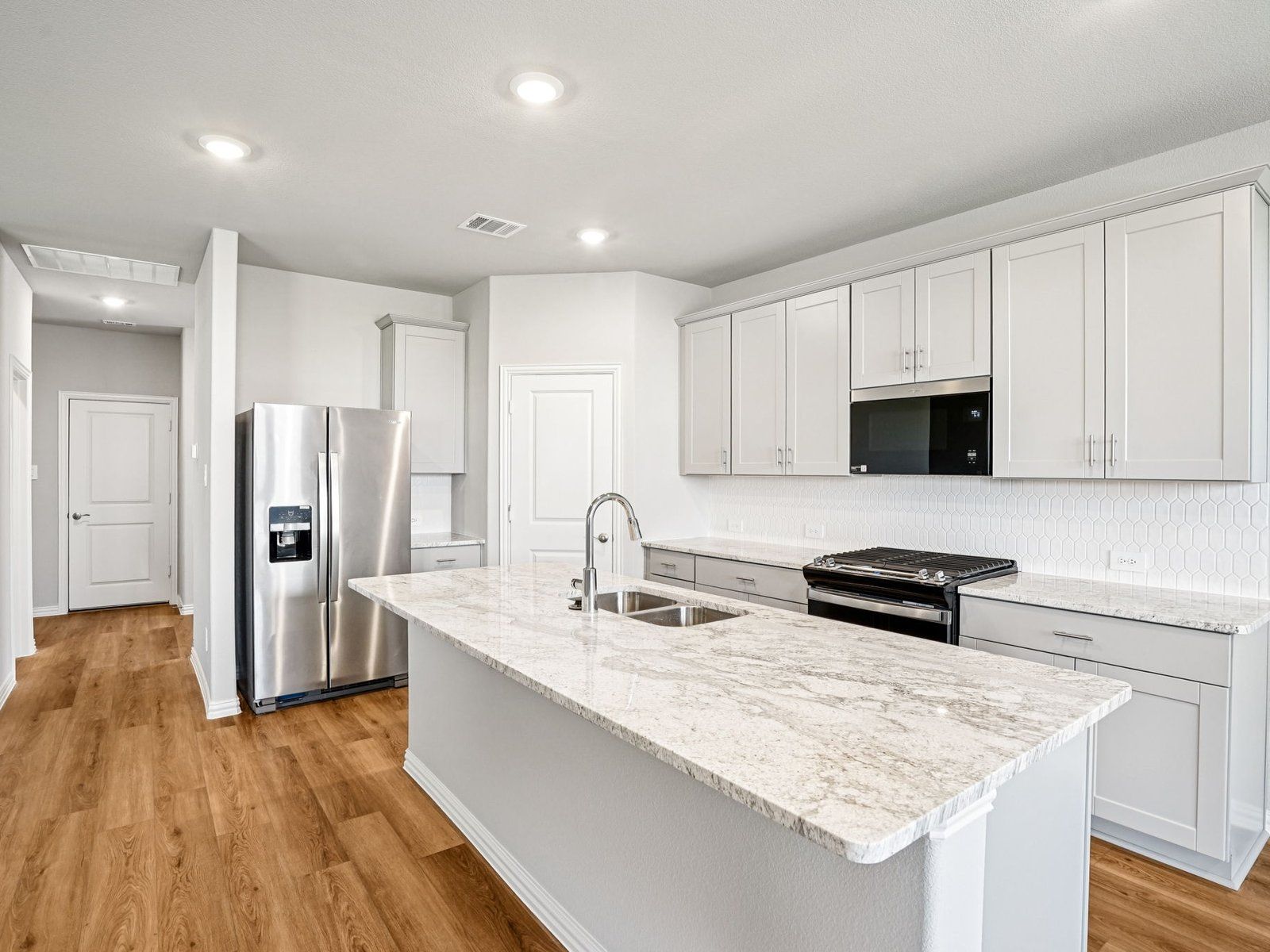 The Independence floorplan with the Refined 1 interior package.:Kitchen