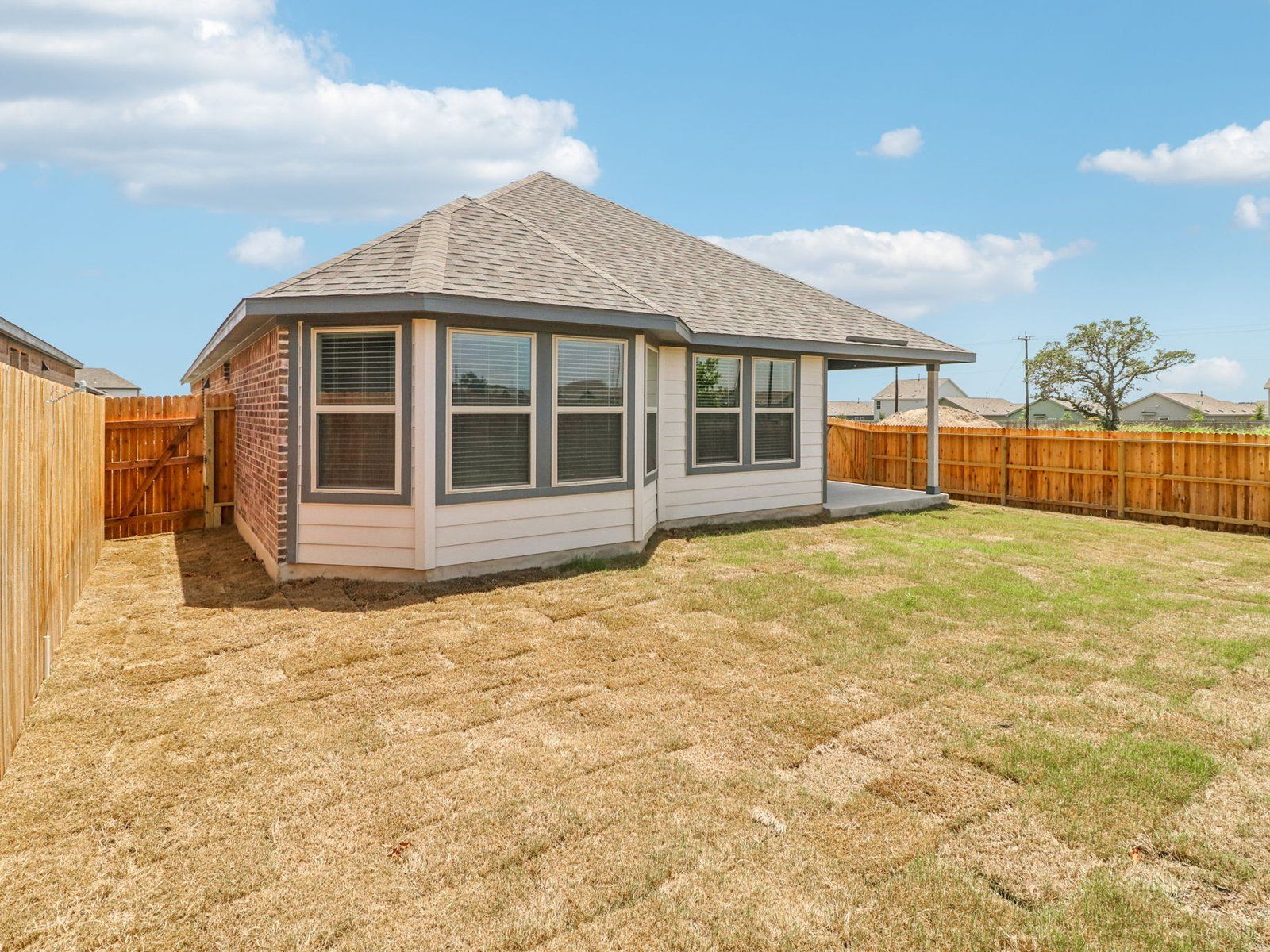 Back exterior of the Callaghan floorplan at a Meritage Homes community.:Back Exterior