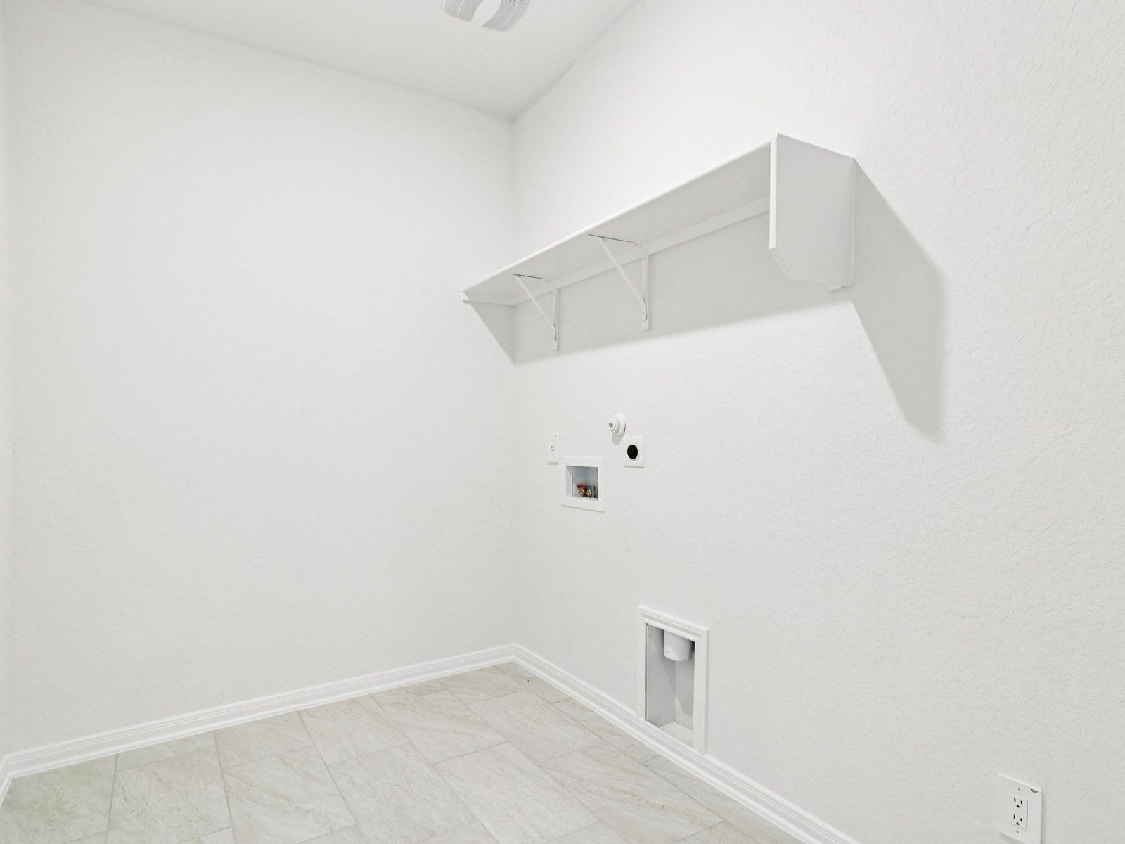 Laundry room in the Allen floorplan at a Meritage Homes community.:Laundry Room