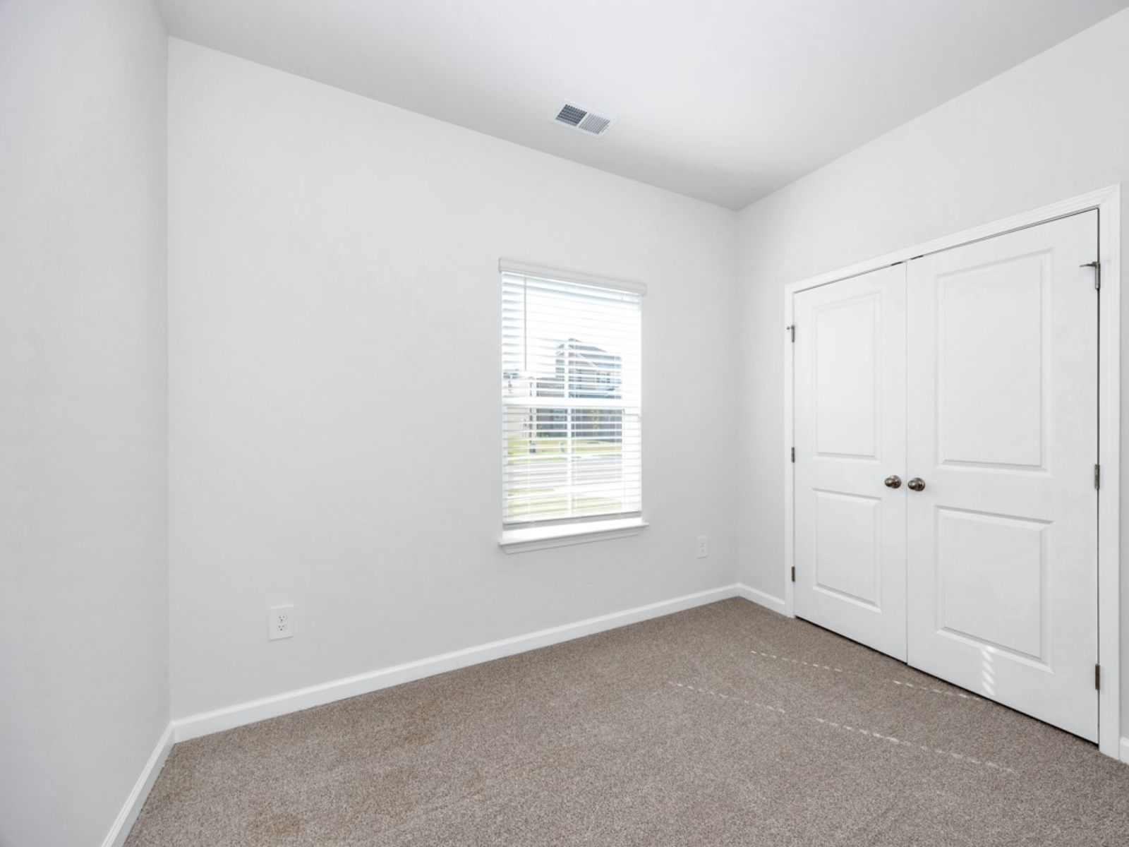 The Carolina floorplan with the Radiant White interior package.:Secondary Bedroom