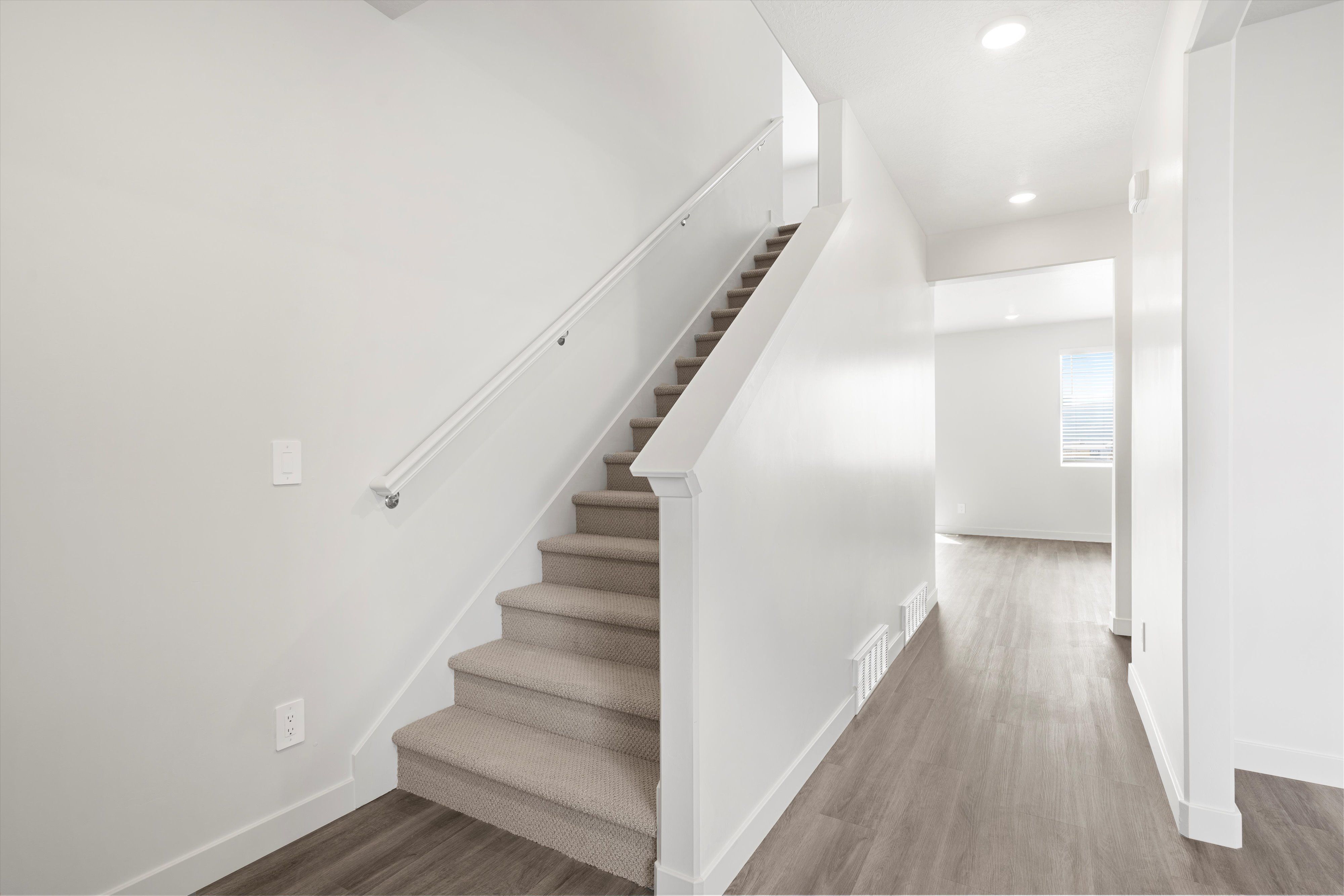 SLC_Cottonwood_#4211_Hallway_A_3523-N-Browning-St-Eagle-Mountain-UT.jpg:The Cottonwood floorplan interior image taken at a Meritage Homes Community in Eagle Mountain, UT.
