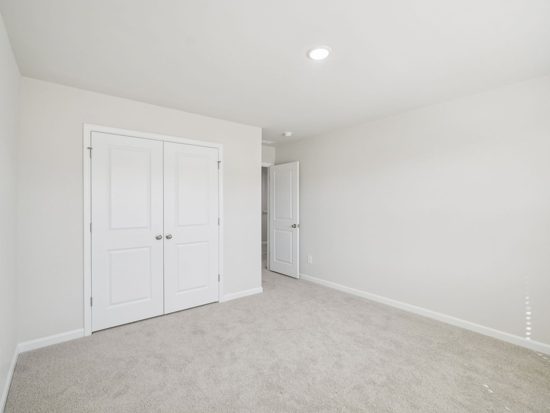 Secondary bedroom in the Taylorsville floorplan at a Meritage Homes community in Garner, NC.:Secondary Bedroom