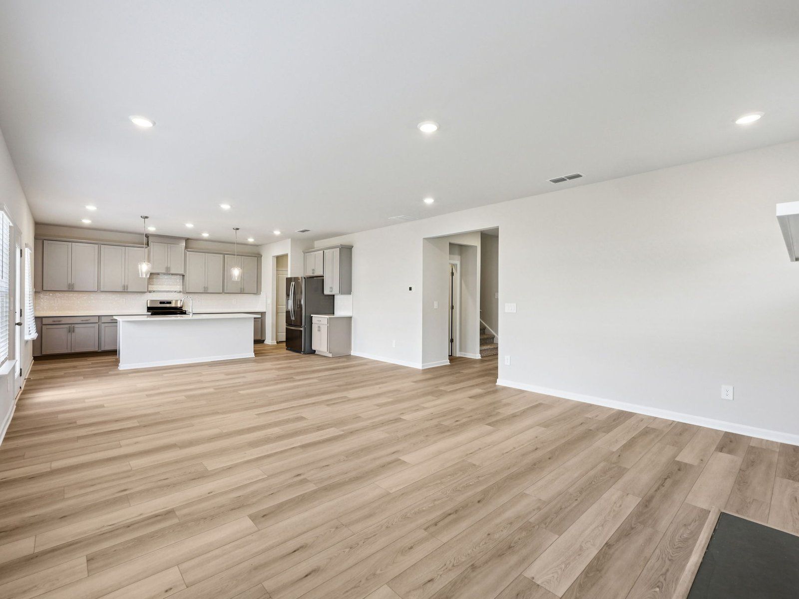 The Taylorsville floorplan with the Fresh Gray interior package.:Great Room
