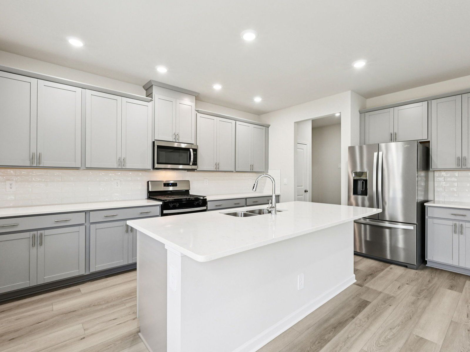 The Taylorsville floorplan with the Fresh Gray interior package.:Kitchen