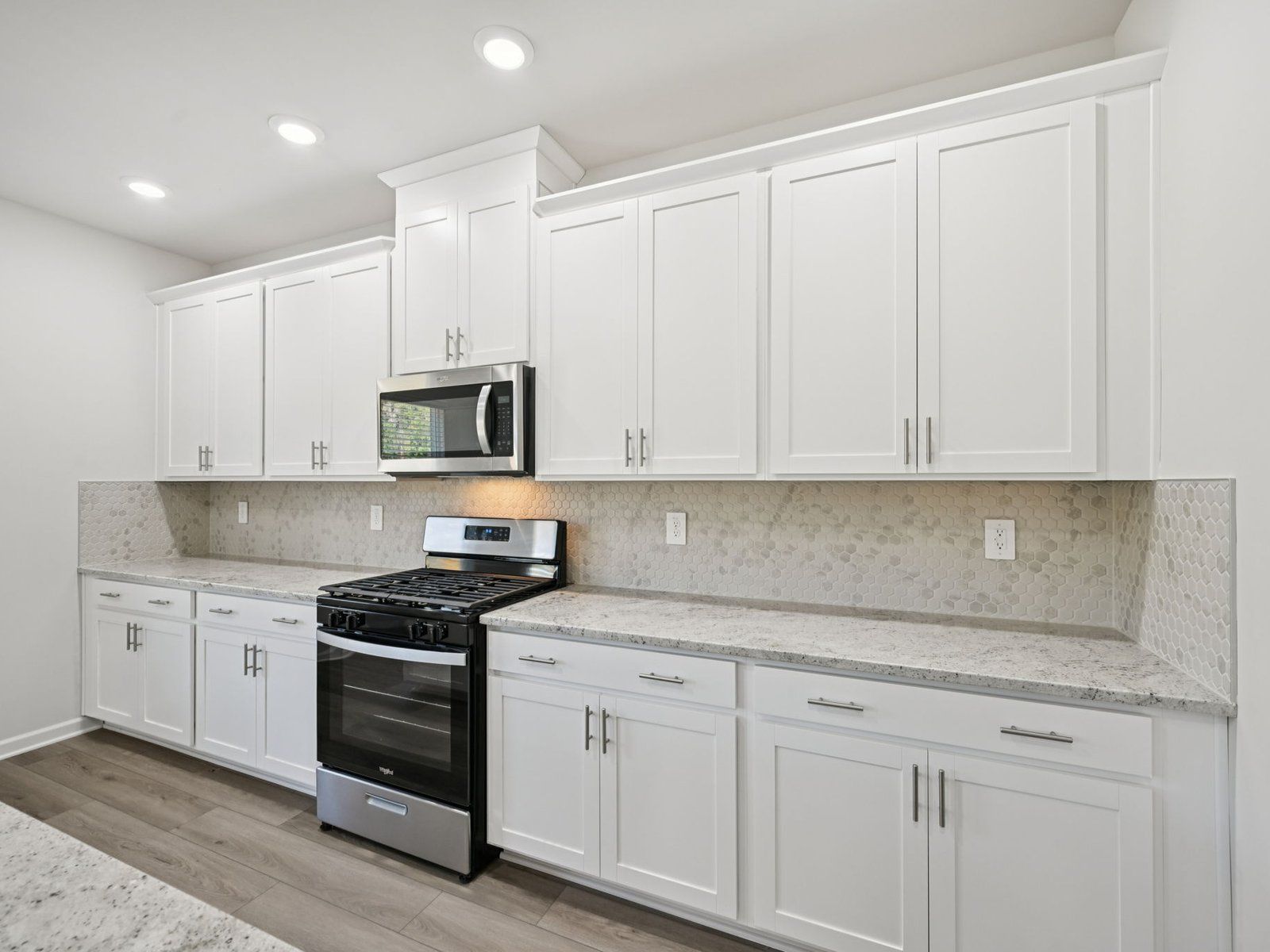 The Taylorsville floorplan with the Elemental White interior package.:Kitchen