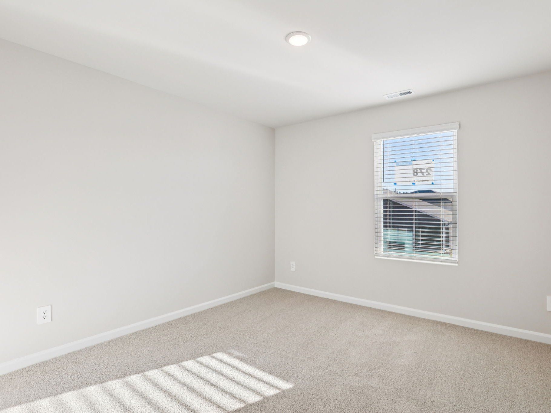 Secondary Bedroom:Secondary bedroom in the Johnson floorplan at a Meritage Homes community in Garner, NC.