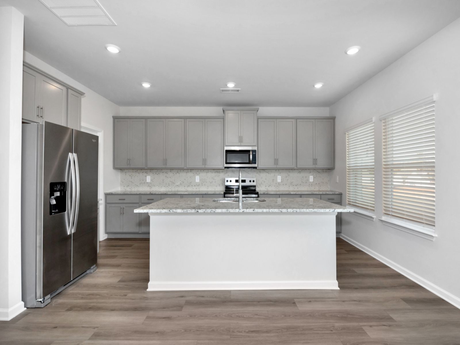 The Dakota floorplan with the Elemental Gray interior package.:Kitchen