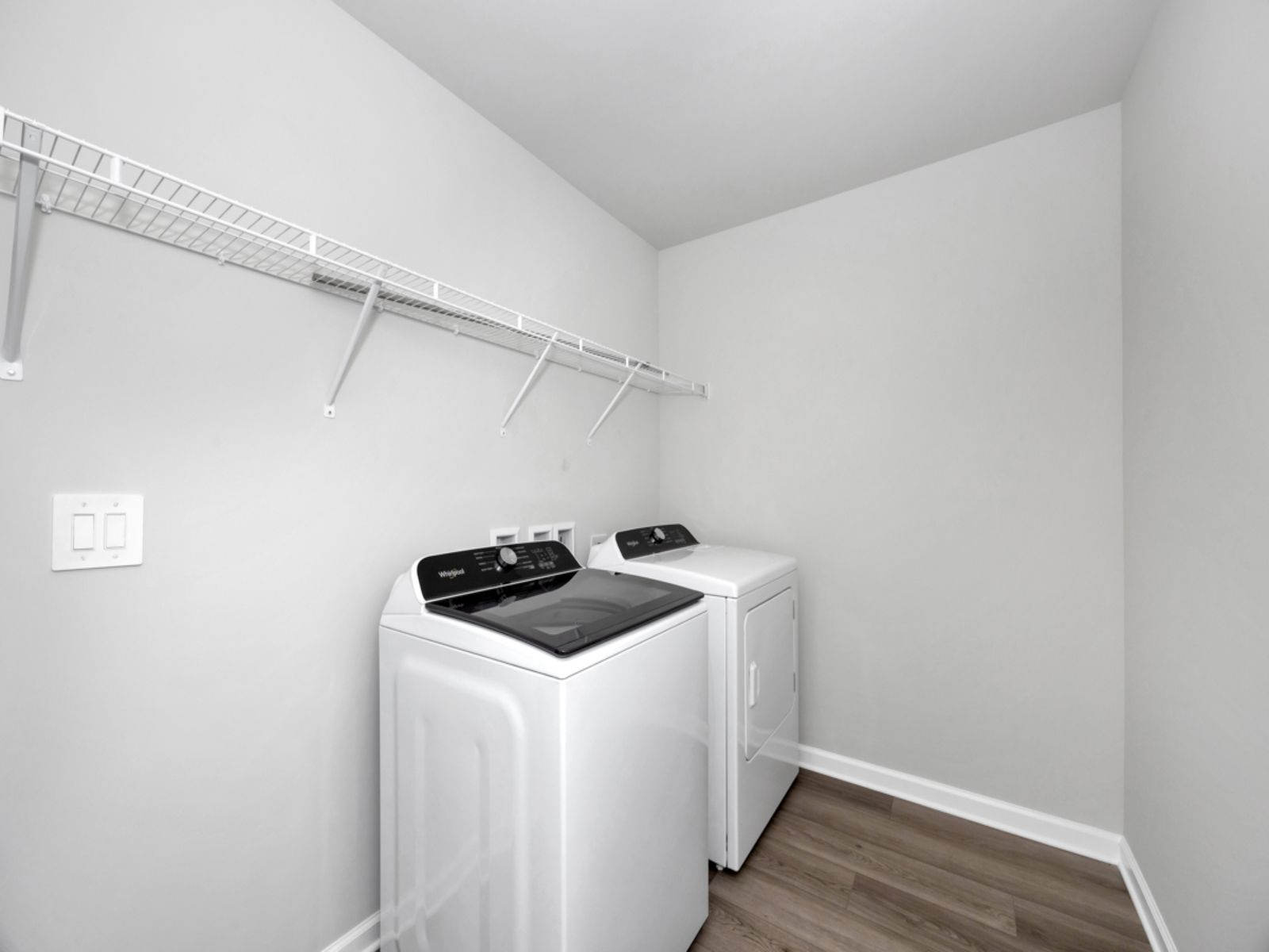 The Dakota floorplan with the Elemental Gray interior package.:Laundry Room
