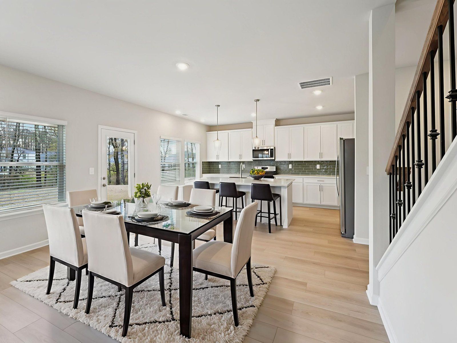 The Dakota floorplan with the Essence White interior package.:Dining Room