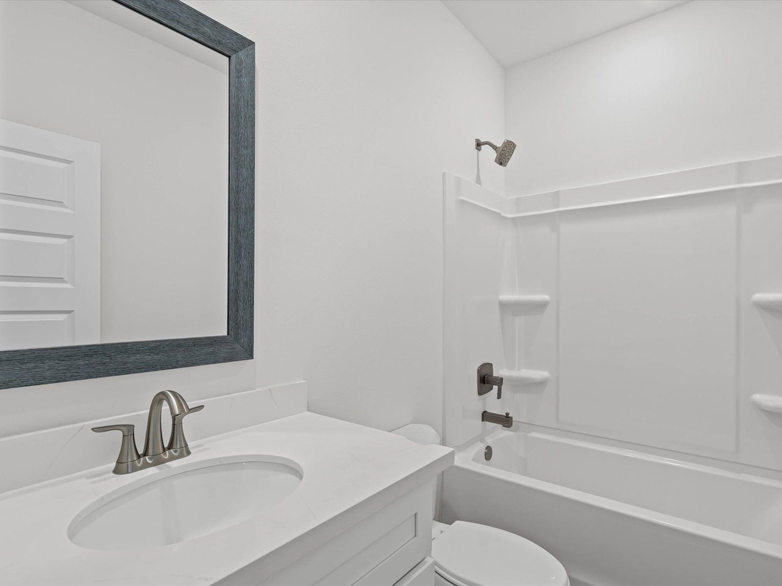 Secondary Bathroom:Secondary bathroom in the Sandpiper floorplan at a Meritage Homes community in Biloxi, MS.