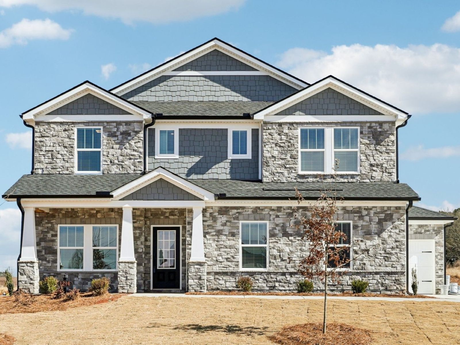 Front Exterior:The Johnson floorplan with Elevation K modeled at River Pointe.