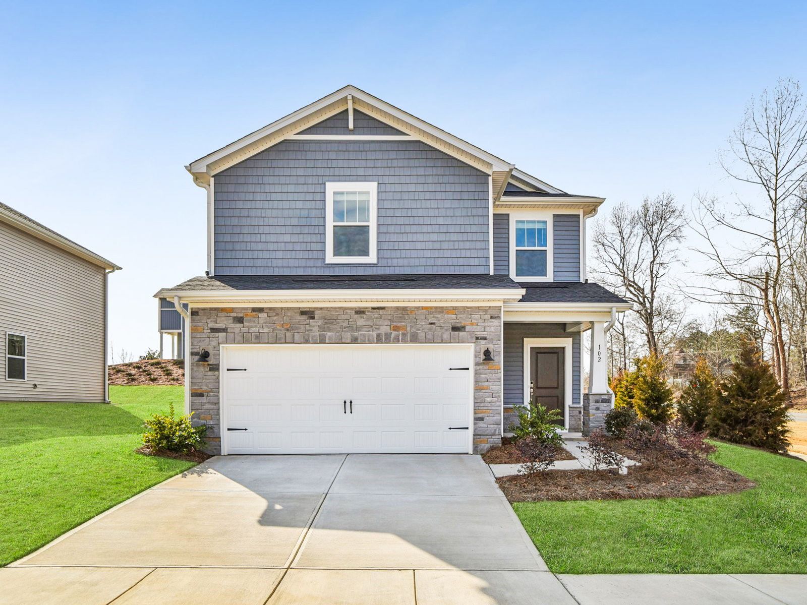 Front Exterior:Welcome home to the Finley floorplan at a Meritage Homes community in Charlotte, NC.