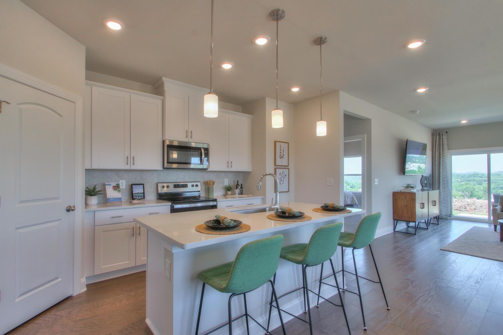 Enjoy your morning coffee at the stunning kitchen island.:Enjoy your morning coffee at the stunning kitchen island.