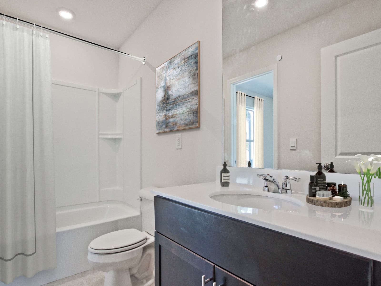 RAL_The-Grove_Carmine_Interior_Secondary-Bath.jpg:Secondary bathroom in the Carmine floorplan at a Meritage Homes community in Atlanta, GA.