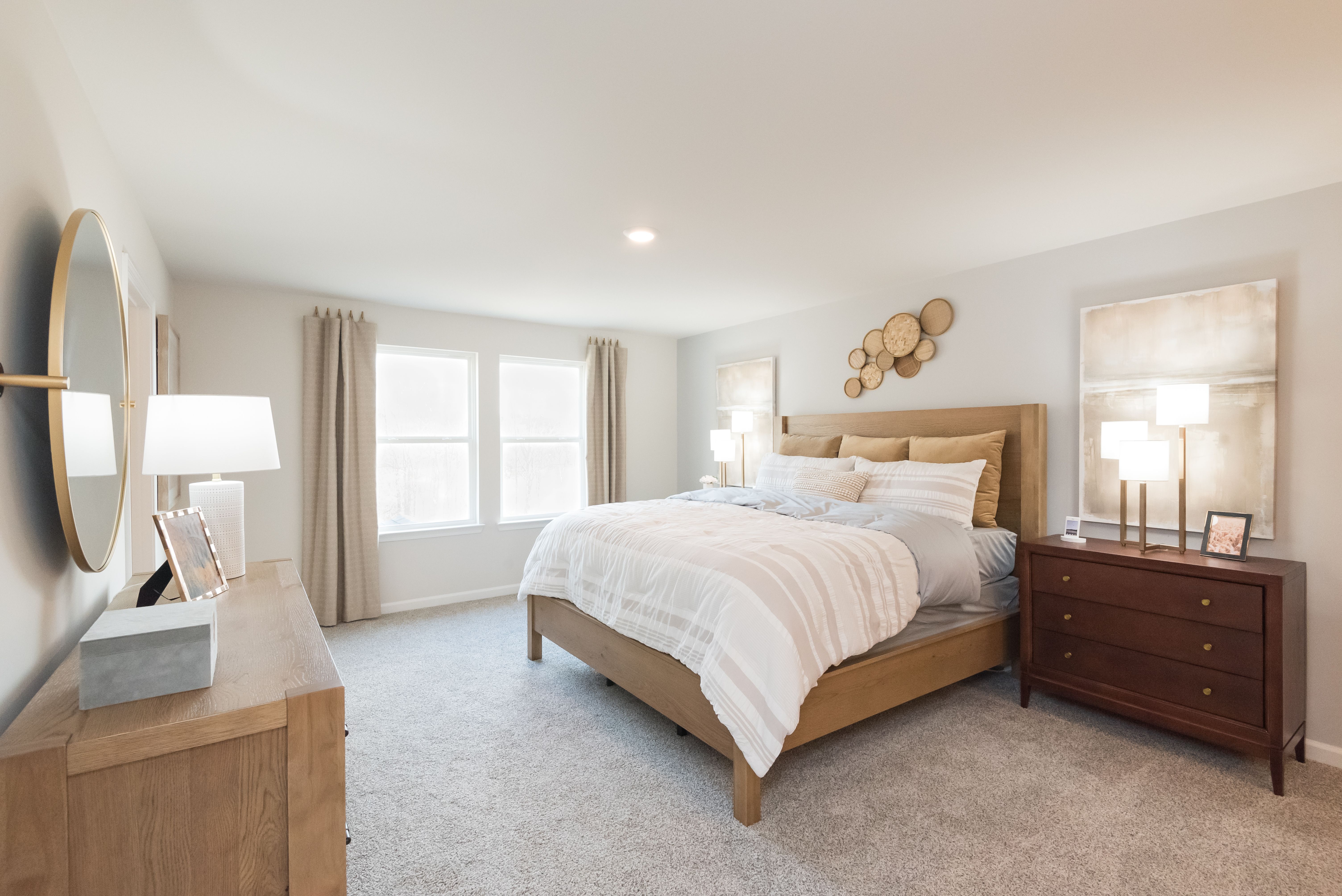 Primary Bedroom:The Chatham floorplan with the Elemental White interior package modeled at Hamilton Crossing.