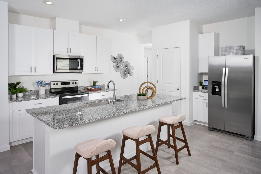 Kitchen of the Olympic plan modeled at Lakes at Bella Lago.:Kitchen of the Olympic plan modeled at Lakes at Bella Lago.