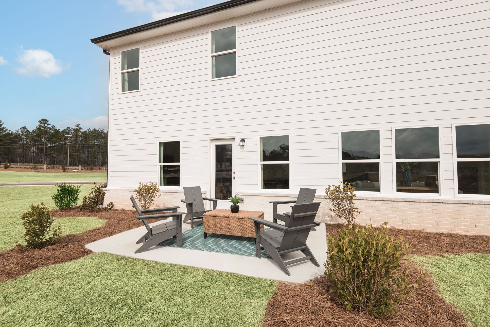 Back Patio:The Taylorsville floorplan with the Lush White interior package modeled at Parkside at Grayson.