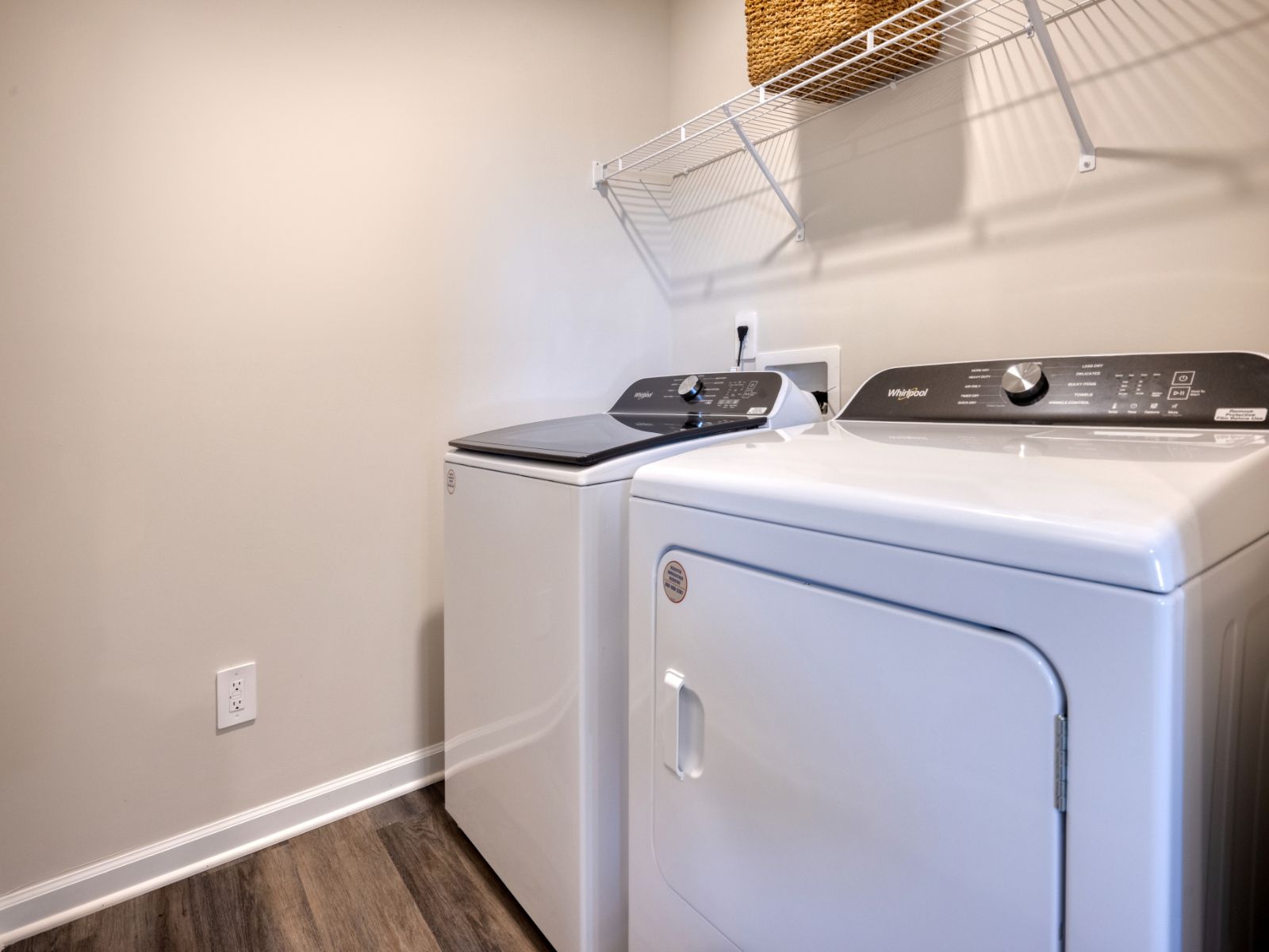 RAL_StillhouseFarmsTownes_Amber_Laundry_632RollingFieldsDrive_Model.jpg:Laundry room in the Amber floorplan at a Meritage Homes community in Graham, NC.