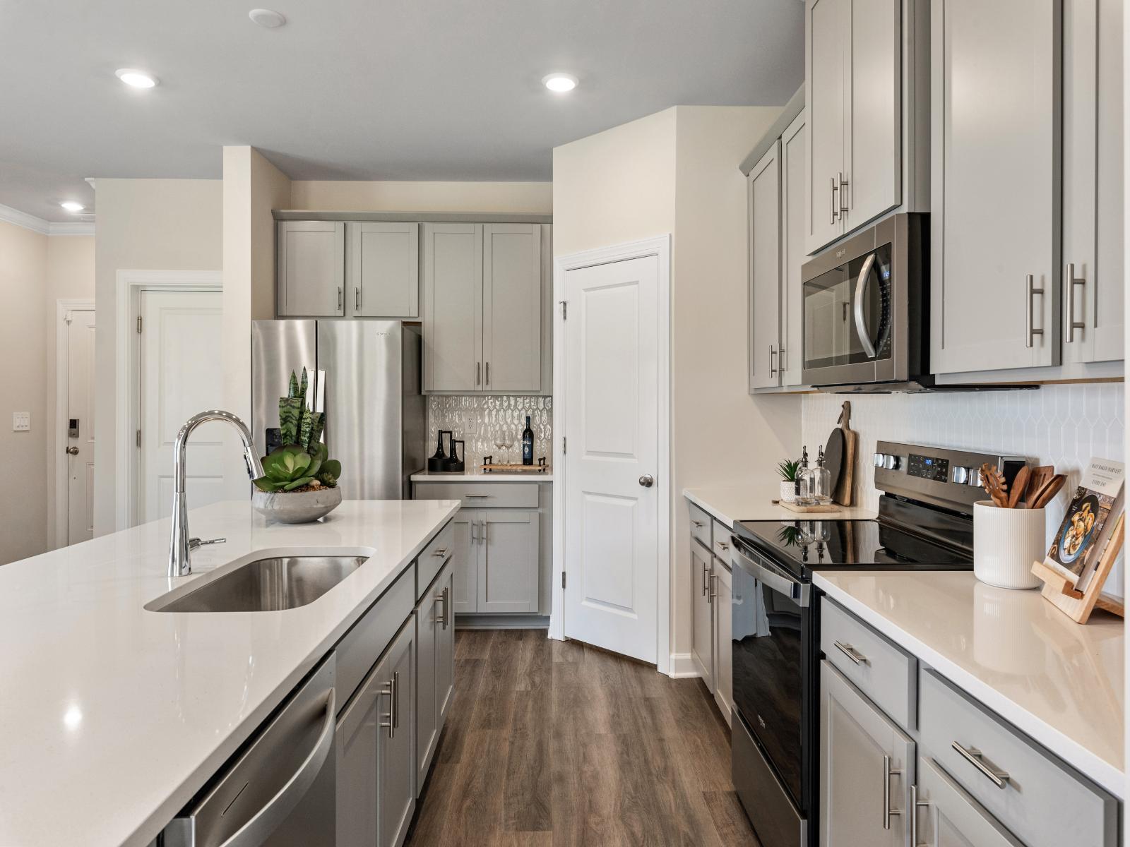 Kitchen:The well-appointed kitchen with a large island and generous pantry size makes meal prep a breeze.