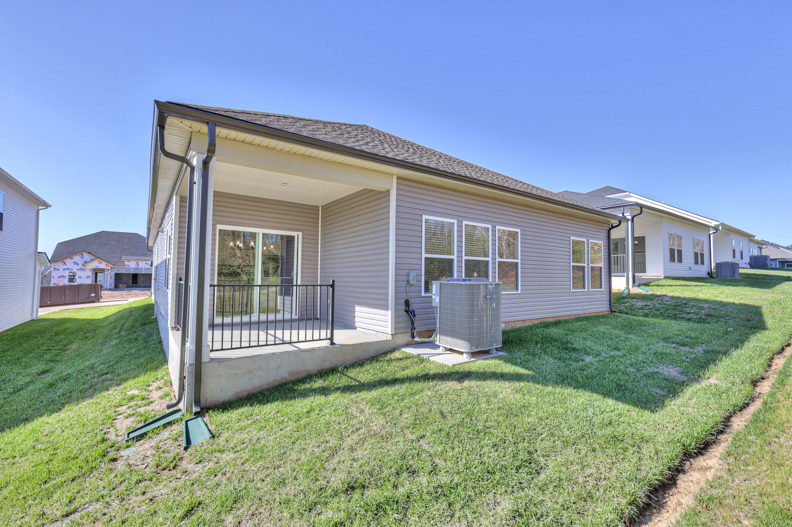 Enjoy summer nights on the covered back patio.:NSH_Wyncliff_Newport_BackPatio_1255BlufftonCircle.jpg