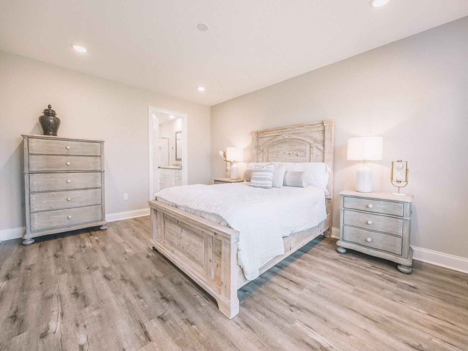 GLF_ElliottHomes_Opal_C143_PrimaryBed2.jpg:Primary bedroom in the Opal floorplan at a Meritage Homes community in Gulfport, MS.