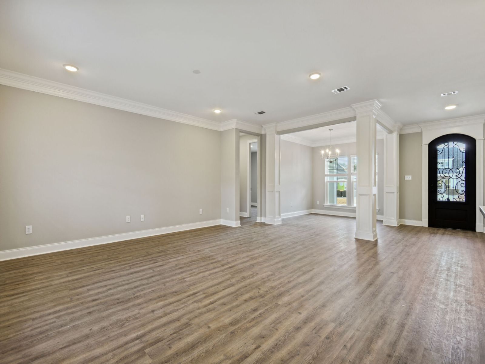 GLF_ElliottHomes_Elliott_A345_GreatRoom.jpg:Great room in the Elliott floorplan at a Meritage Homes community in Gulfport, MS.